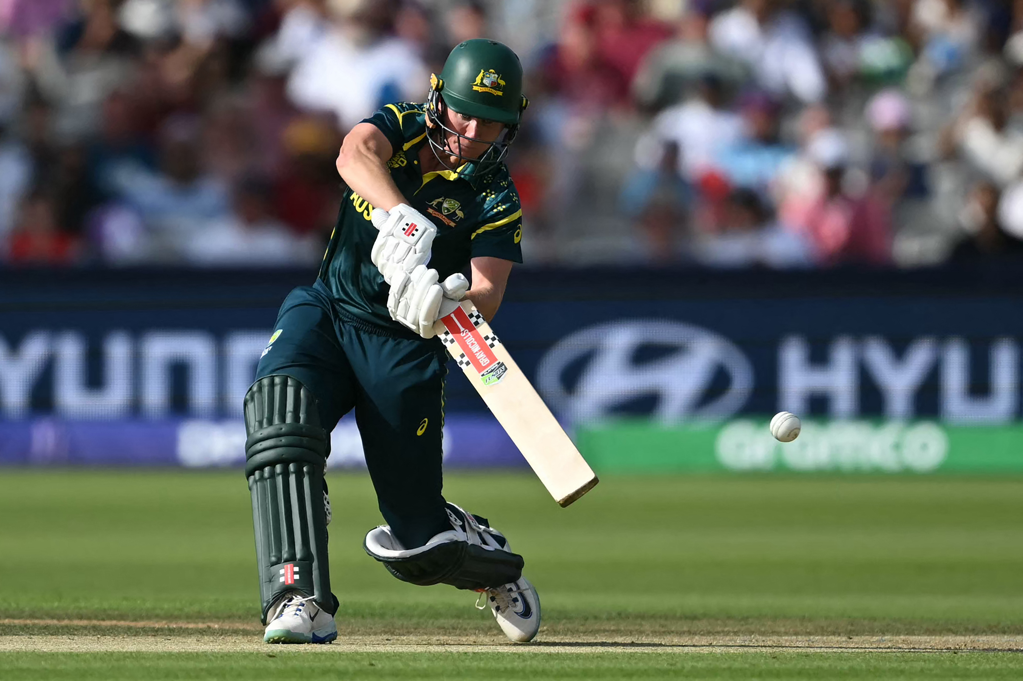 Australia's Beth Mooney swings at a ball during the ICC Women's T20 cricket world cup 2026 final between Australia and England, at Lord's in London on July 5, 2026. (Photo by JUSTIN TALLIS / AFP)
