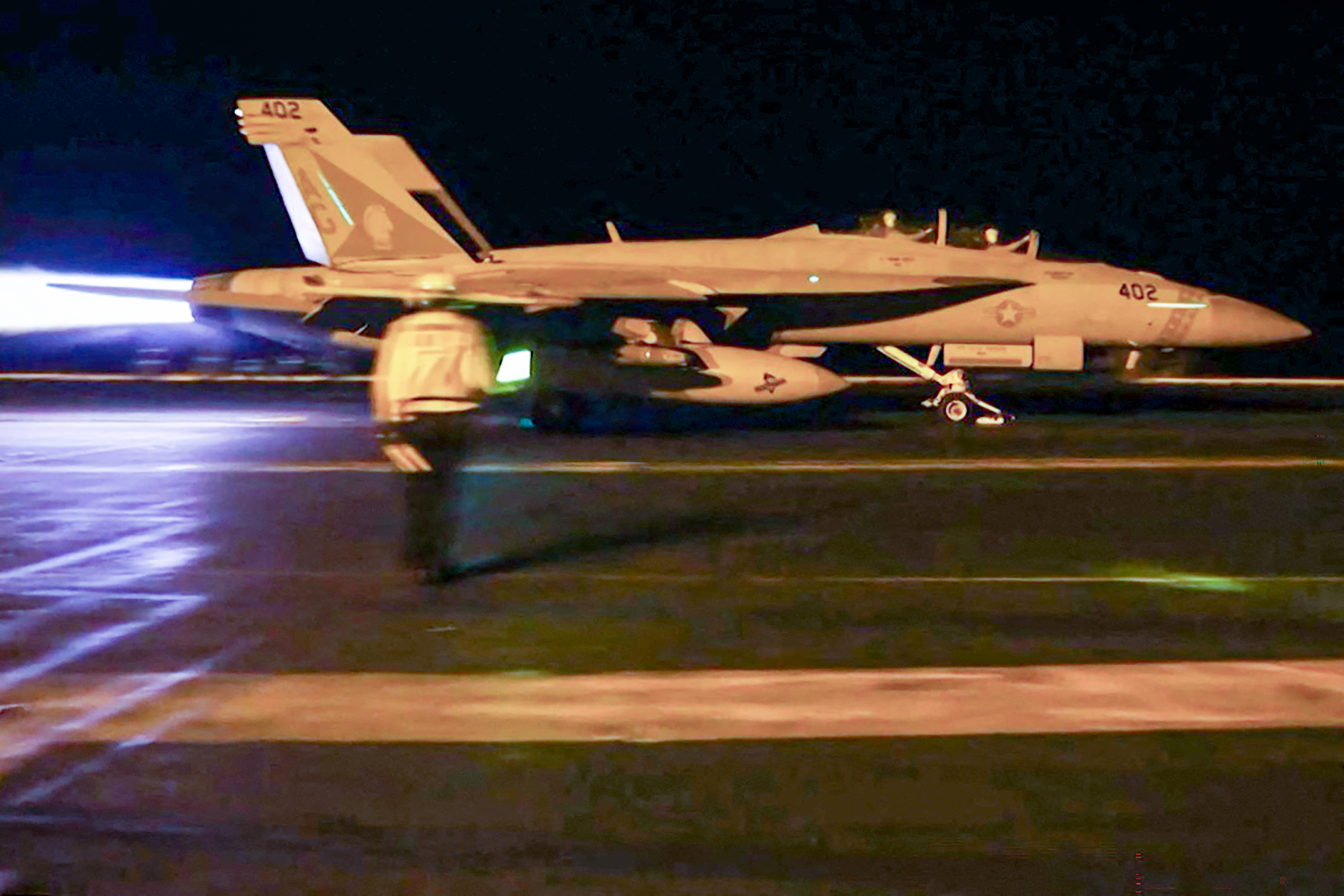 This screen grab made on July 19, 2026 from handout video footage released by the US Central Command (CENTCOM) on July 18, 2026 shows US forces launching what the military says are precision strikes targeting Iranian military capabilities for the eighth consecutive night. US and Iranian strikes extended into July 19 as America said it sought to "punish" the Islamic republic for killing two US servicemen at a base in Jordan, and Gulf states said they responded to Iranian attacks. (Photo by US Central Command (CENTCOM) / AFP) / RESTRICTED TO EDITORIAL USE - MANDATORY CREDIT "AFP PHOTO / US CENTRAL COMMAND PUBLIC AFFAIRS" - HANDOUT - NO MARKETING NO ADVERTISING CAMPAIGNS - DISTRIBUTED AS A SERVICE TO CLIENTS
