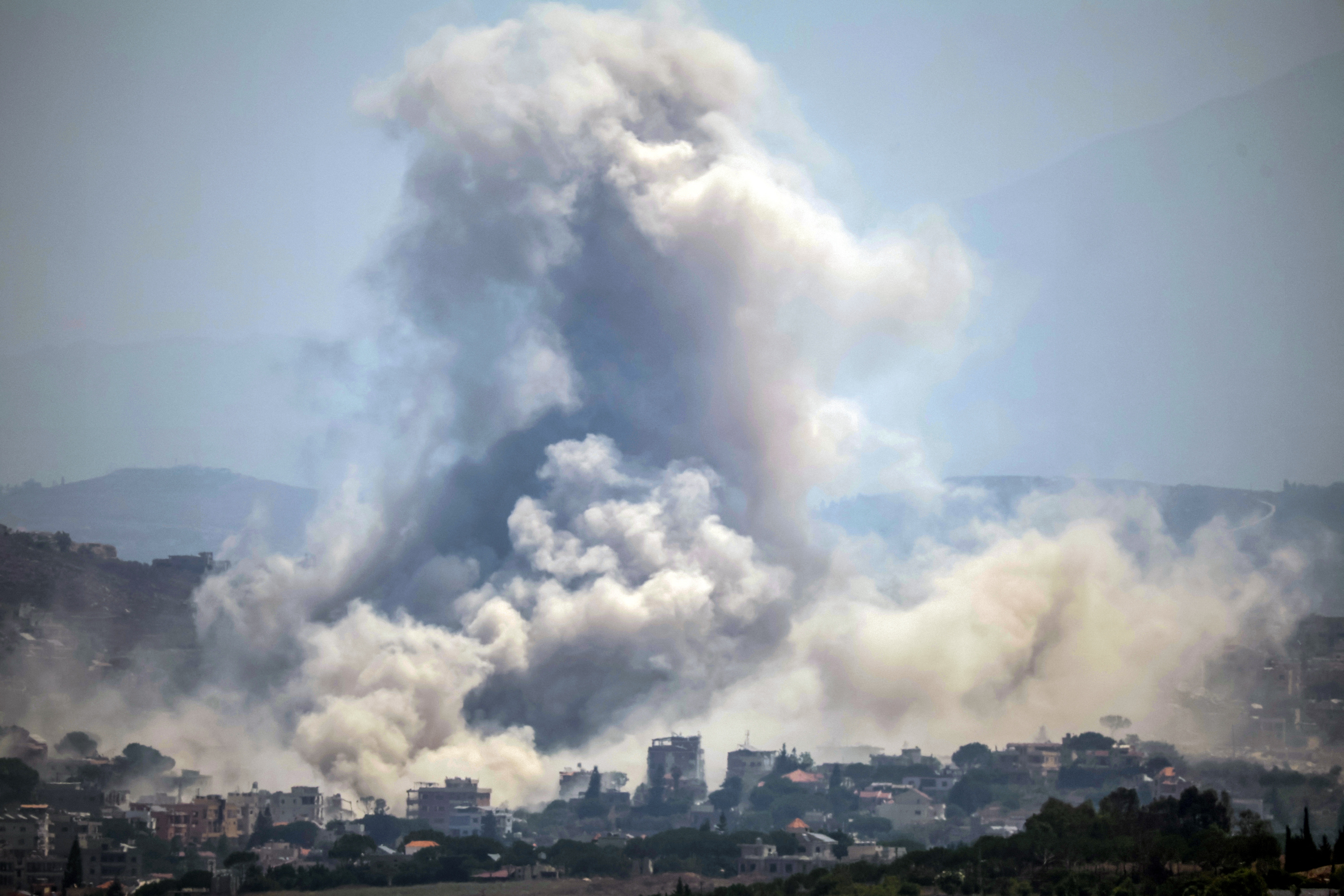 Thick smoke rising from the site of an explosion.