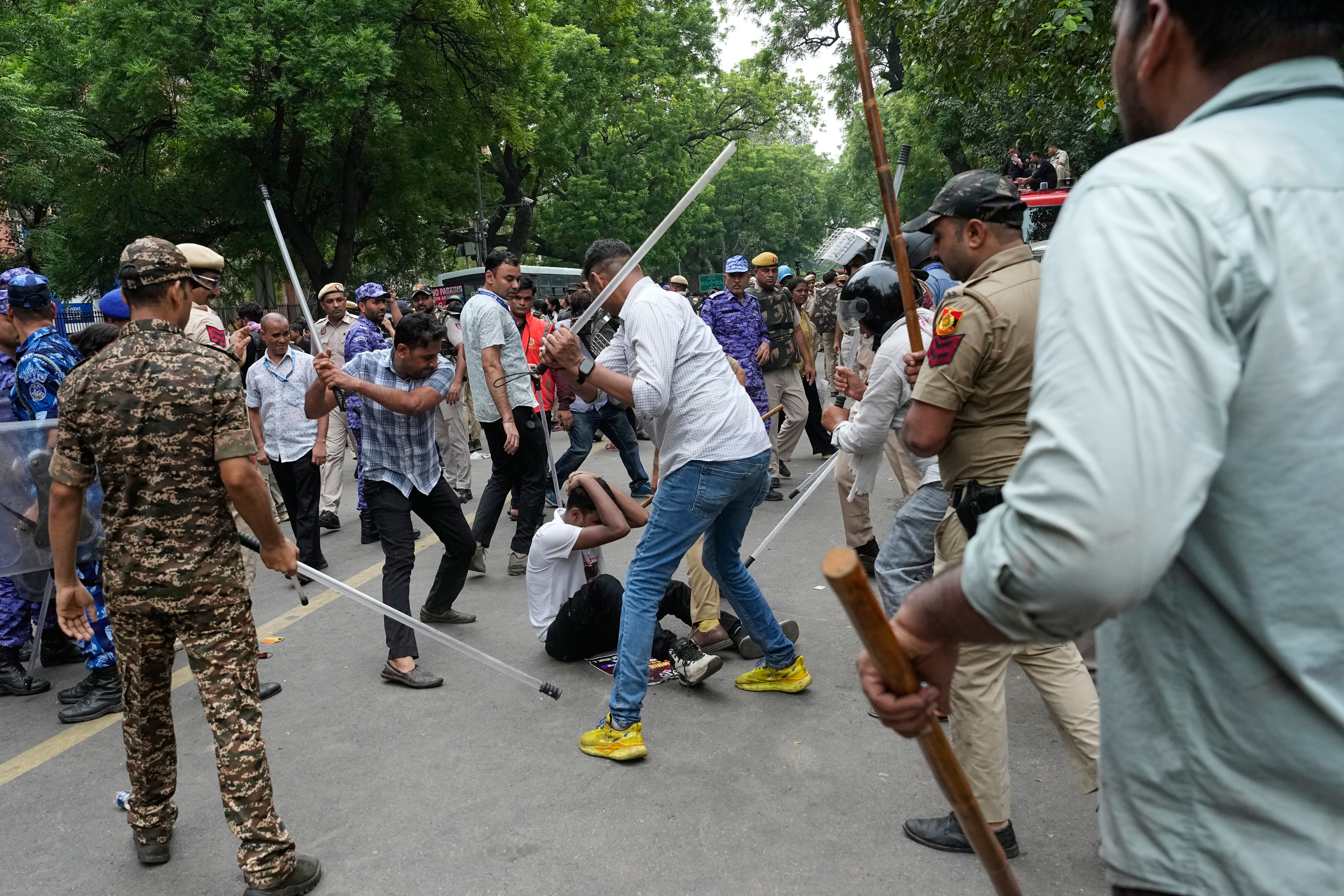 Police use batons to disperse supporters of the Cockroach Janta Party as they attempt to march toward India’s Parliament, demanding the resignation of the education minister, in New Delhi, India, Monday, July 20, 2026.