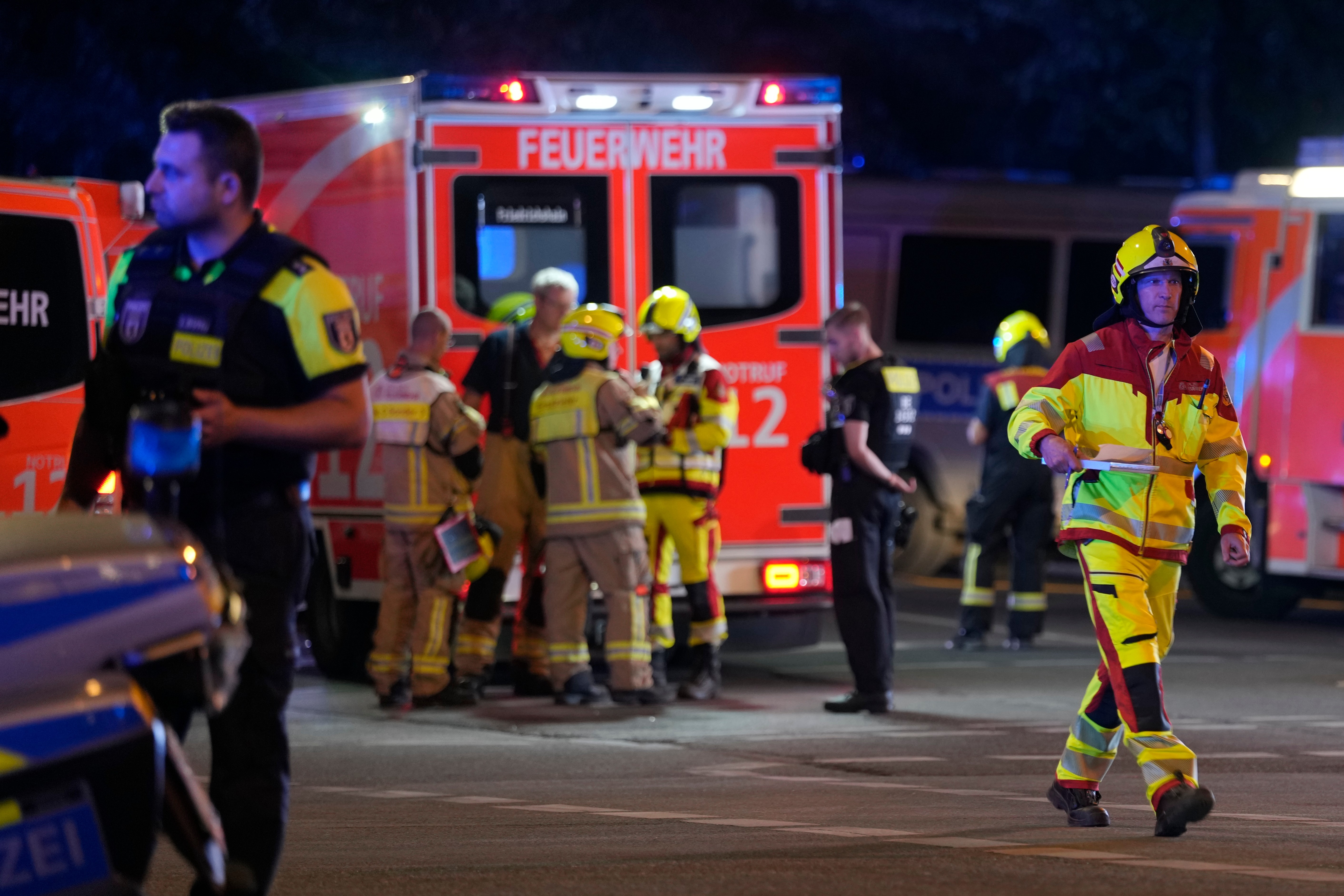 Emergency personnel are deployed at the scene after a car crashed into a crowd at Tiergarten park
