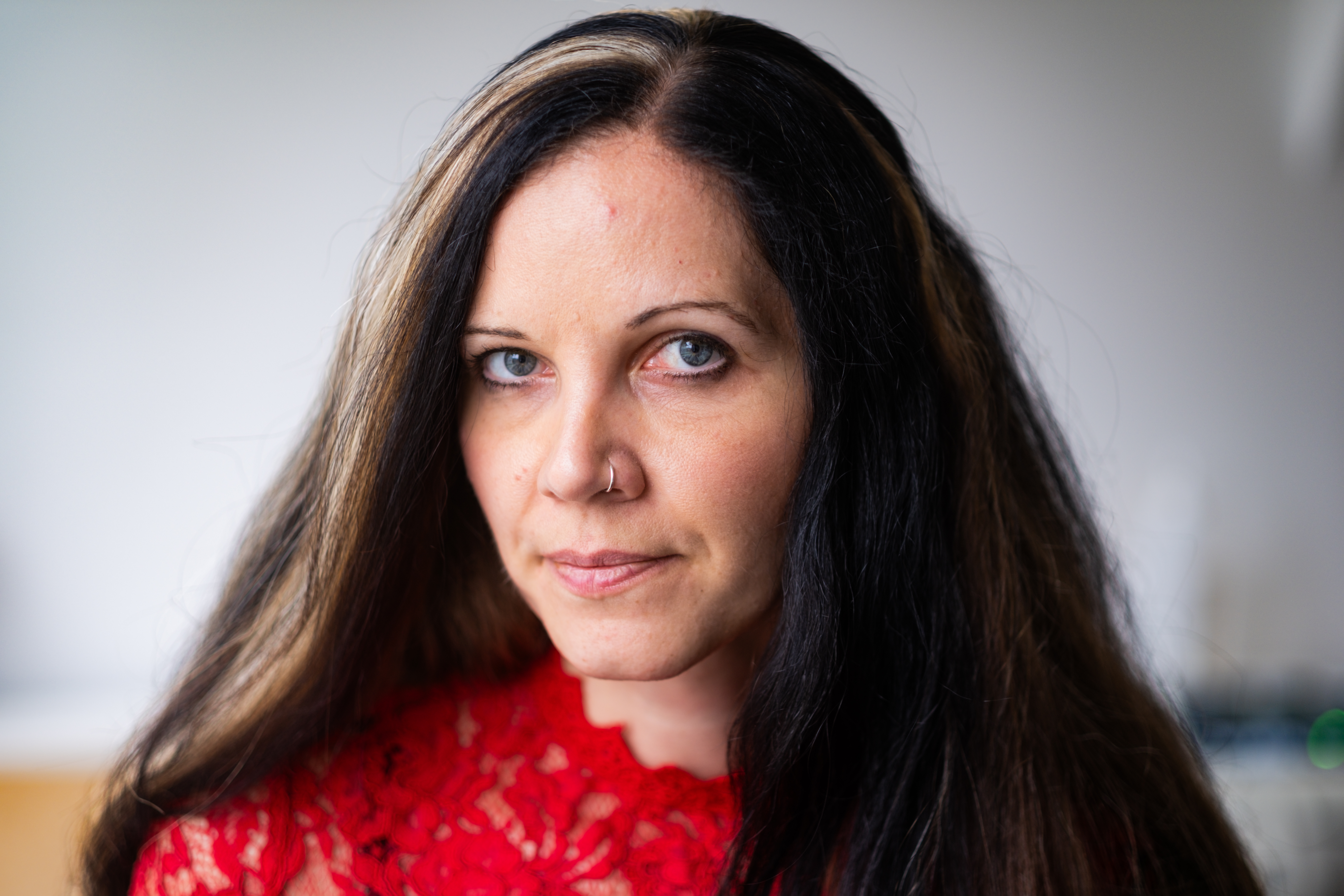 Janina Neufeld poses at the Centre of Neurodevelopmental Disorders at Karolinska Institutet (KIND) in Stockholm, Sweden [Nils Adler/Al Jazeera]