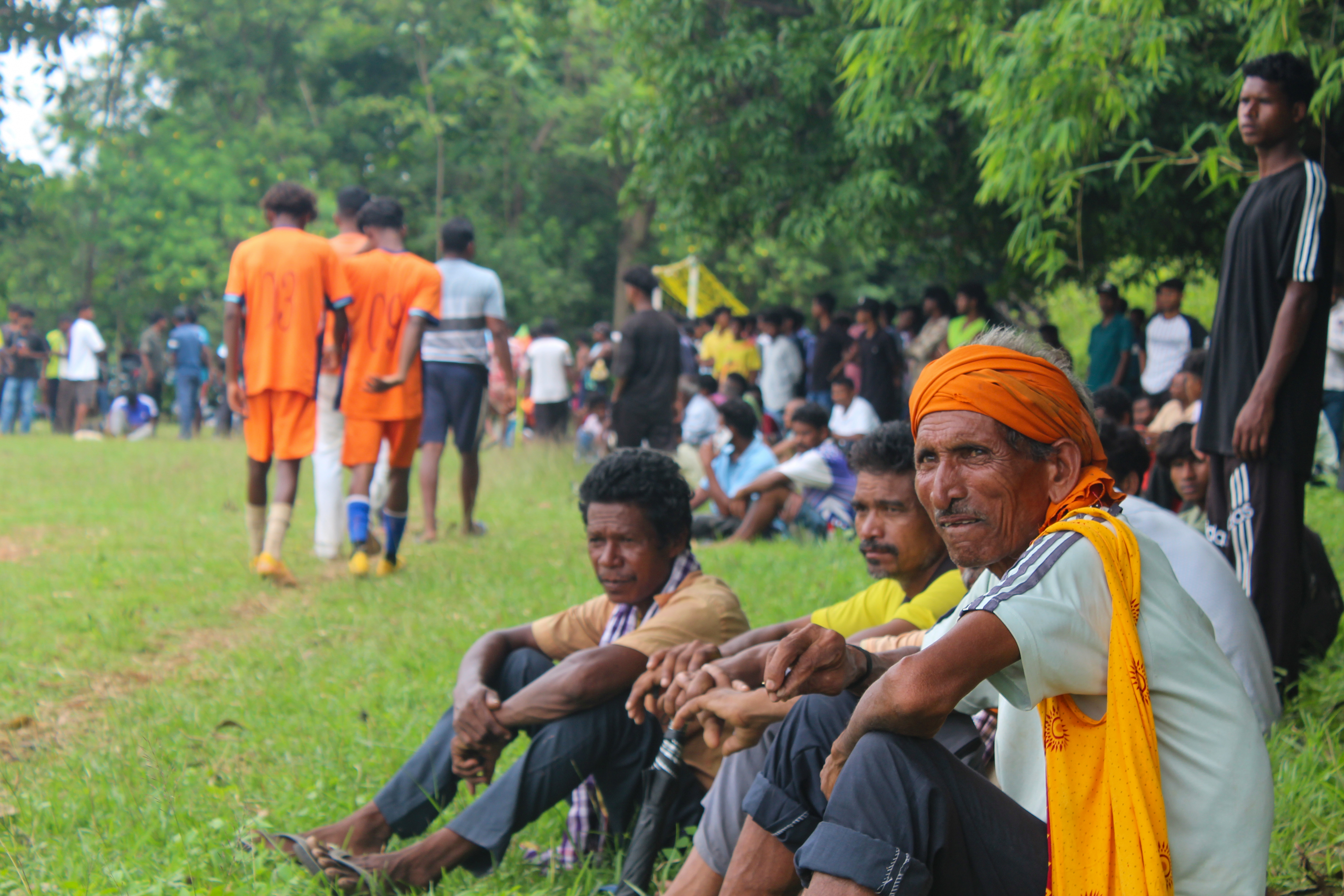 Spectators enjoy a football game at the Rangila Star Tirilbasa tournament in Chaibasa