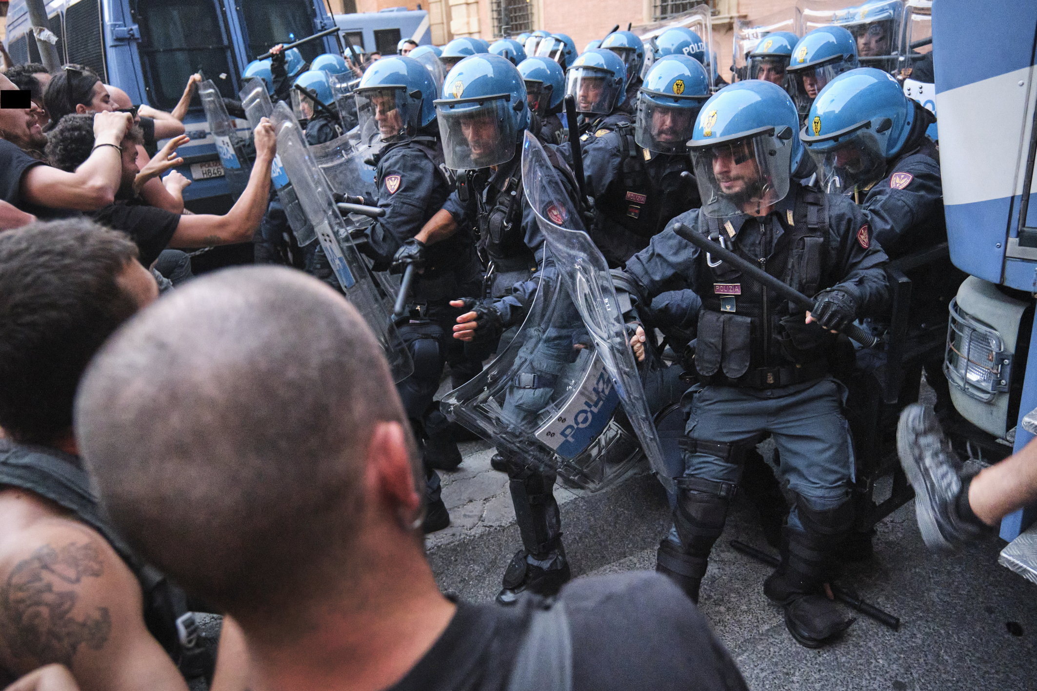 Police clash with protesters in Bologna after a rally over the death of Abderrahim Fakir turned violent.