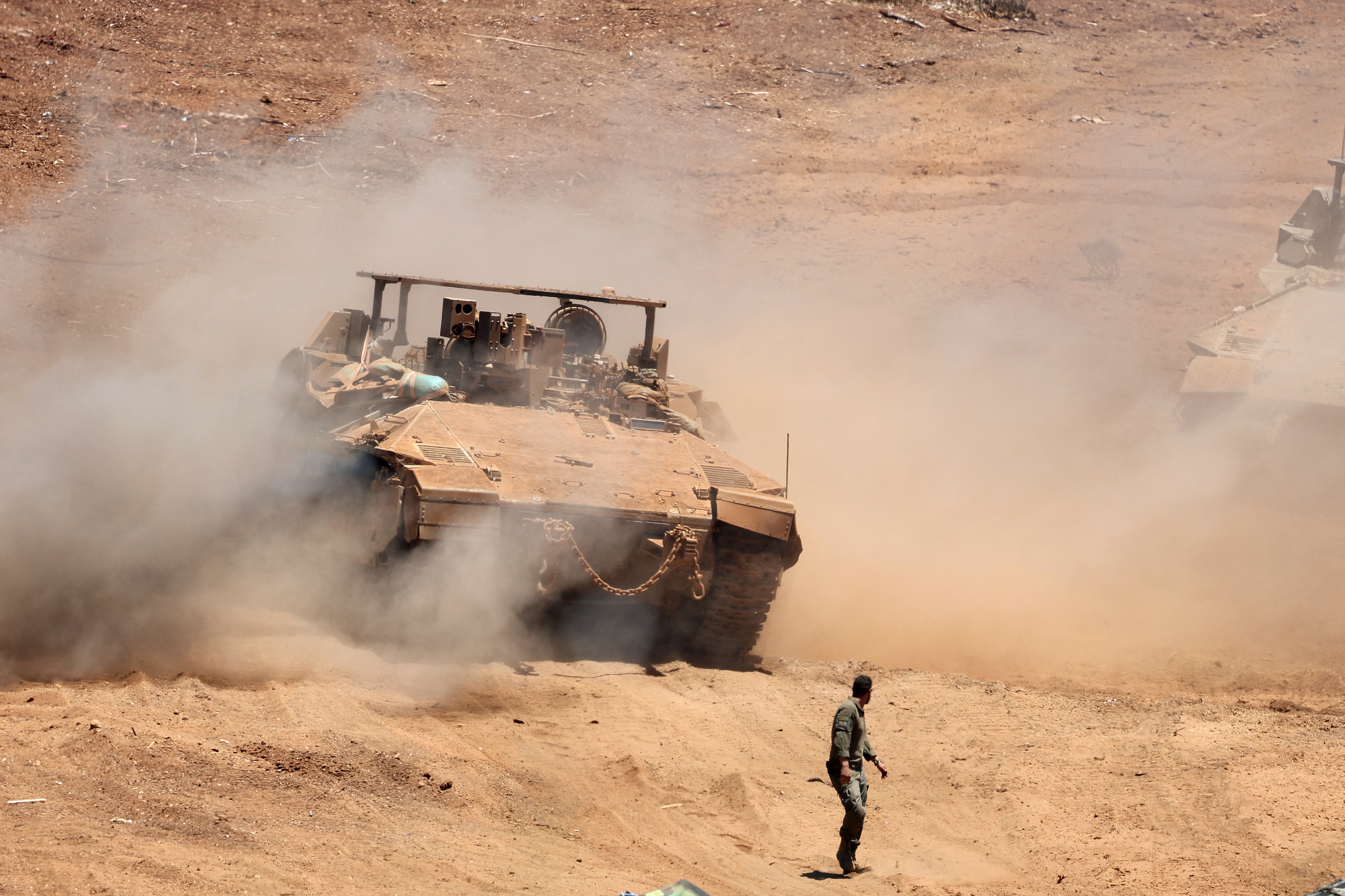 This picture taken from a position in the Upper Galilee in northern Israel shows an Israeli army tank being positioned along the Israel-Lebanon border, on July 1, 2026.
