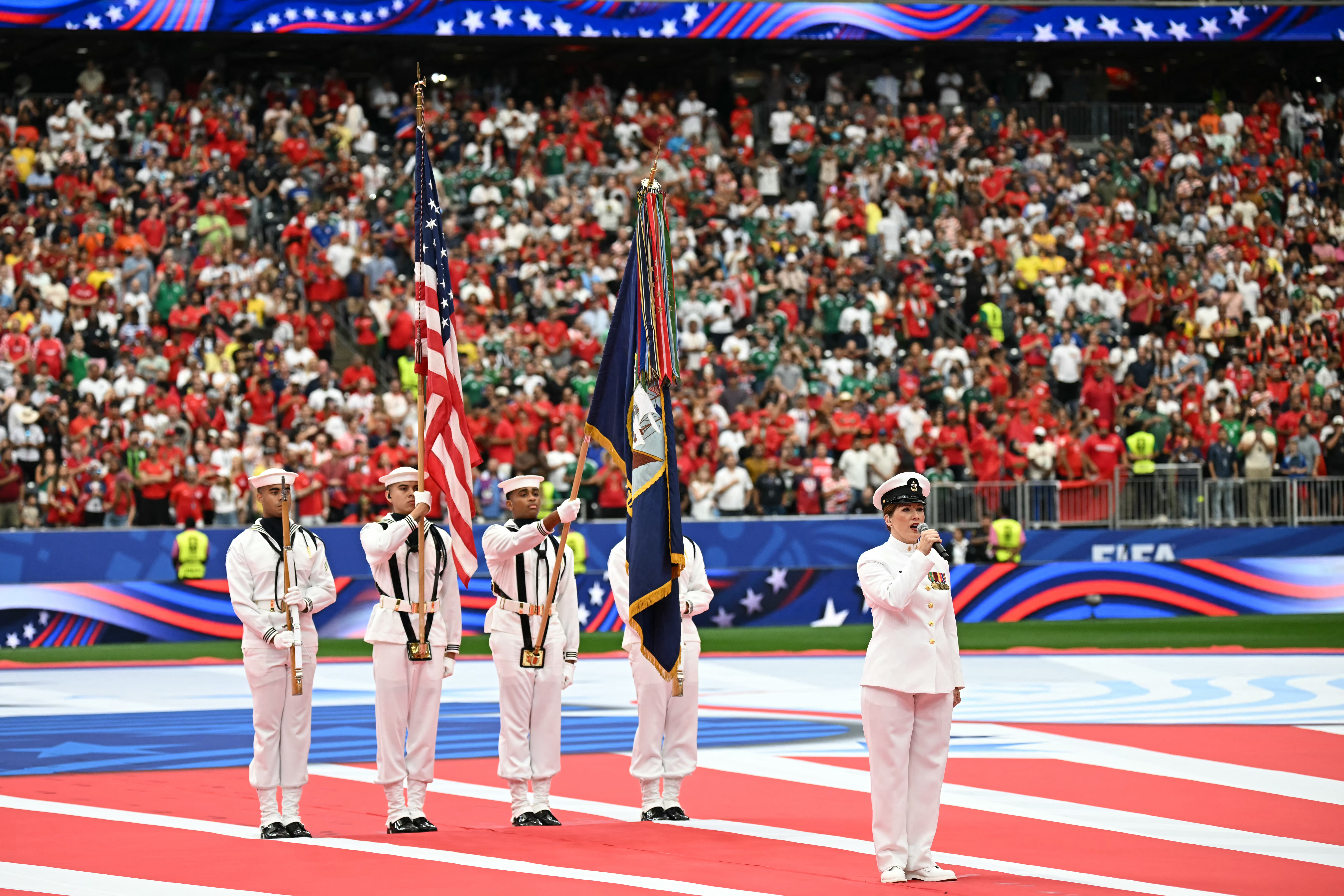 A US Navy Band member peforms the national anthem as part of the Independence Day celebration ahead of the 2026 World Cup round of 16 football match between Canada and Morocco at the Houston Stadium in Houston on July 4, 2026.