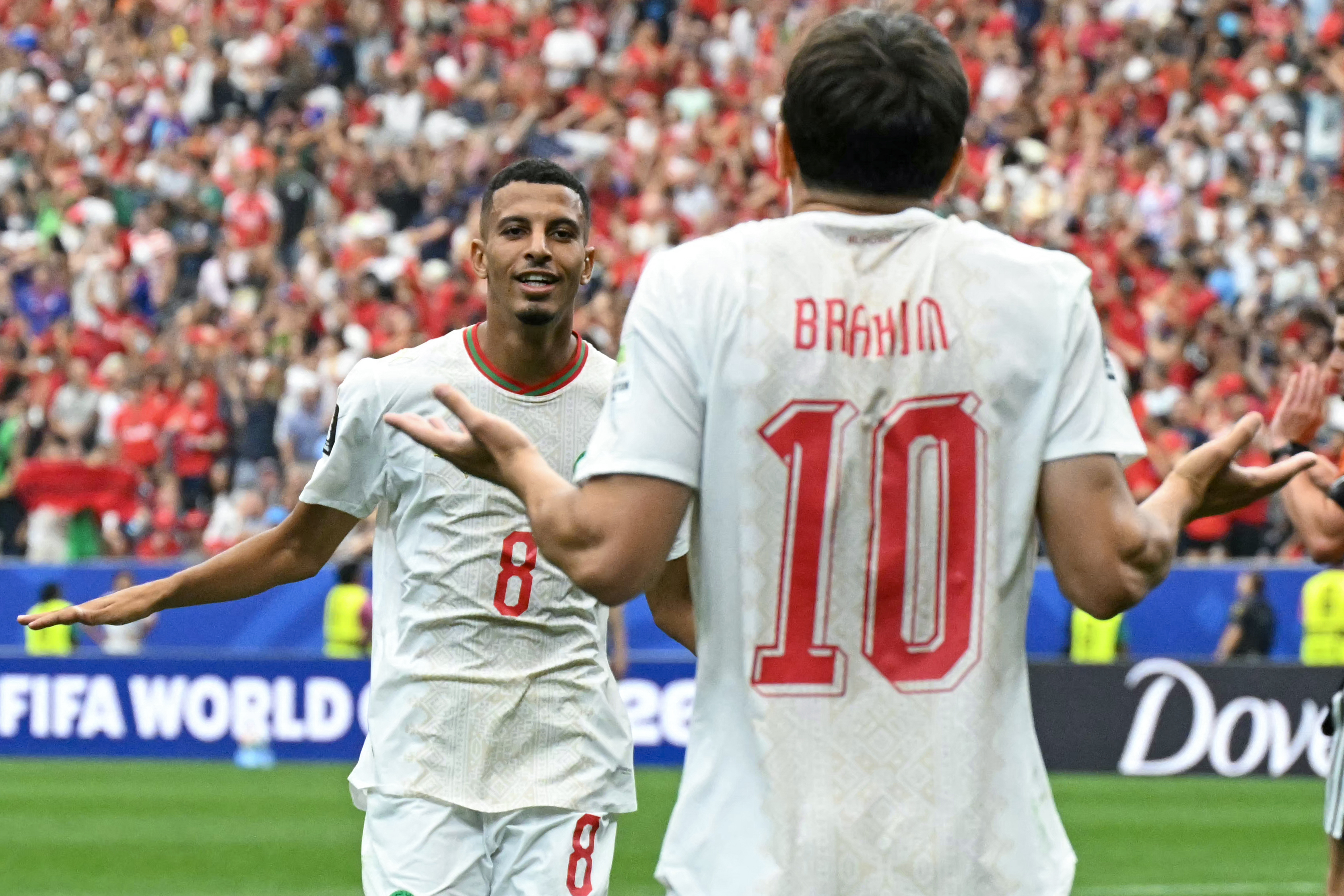 Morocco's midfielder #08 Azzedine Ounahi celebrates scoring his team's second goal with teammate forward #10 Brahim Diaz during the 2026 World Cup round of 16 football match between Canada and Morocco at the Houston Stadium in Houston on July 4, 2026.