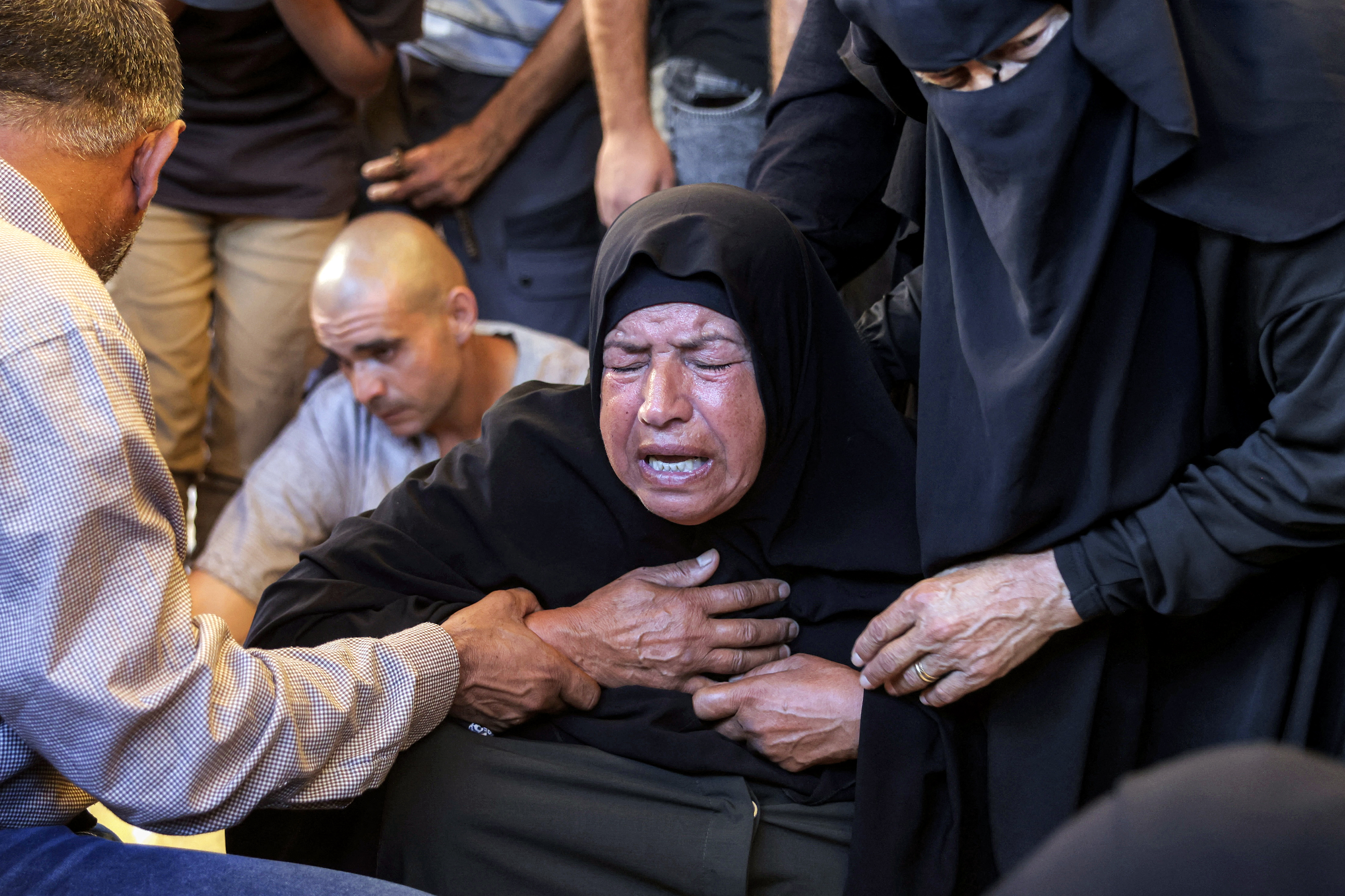 EDITORS NOTE: Graphic content / A mourner reacts during the funeral of a victim who was killed in a reported Israeli strike on a tent according to medics, at Nasser Medical Complex in Khan Yunis in the southern Gaza Strip on July 8, 2026.