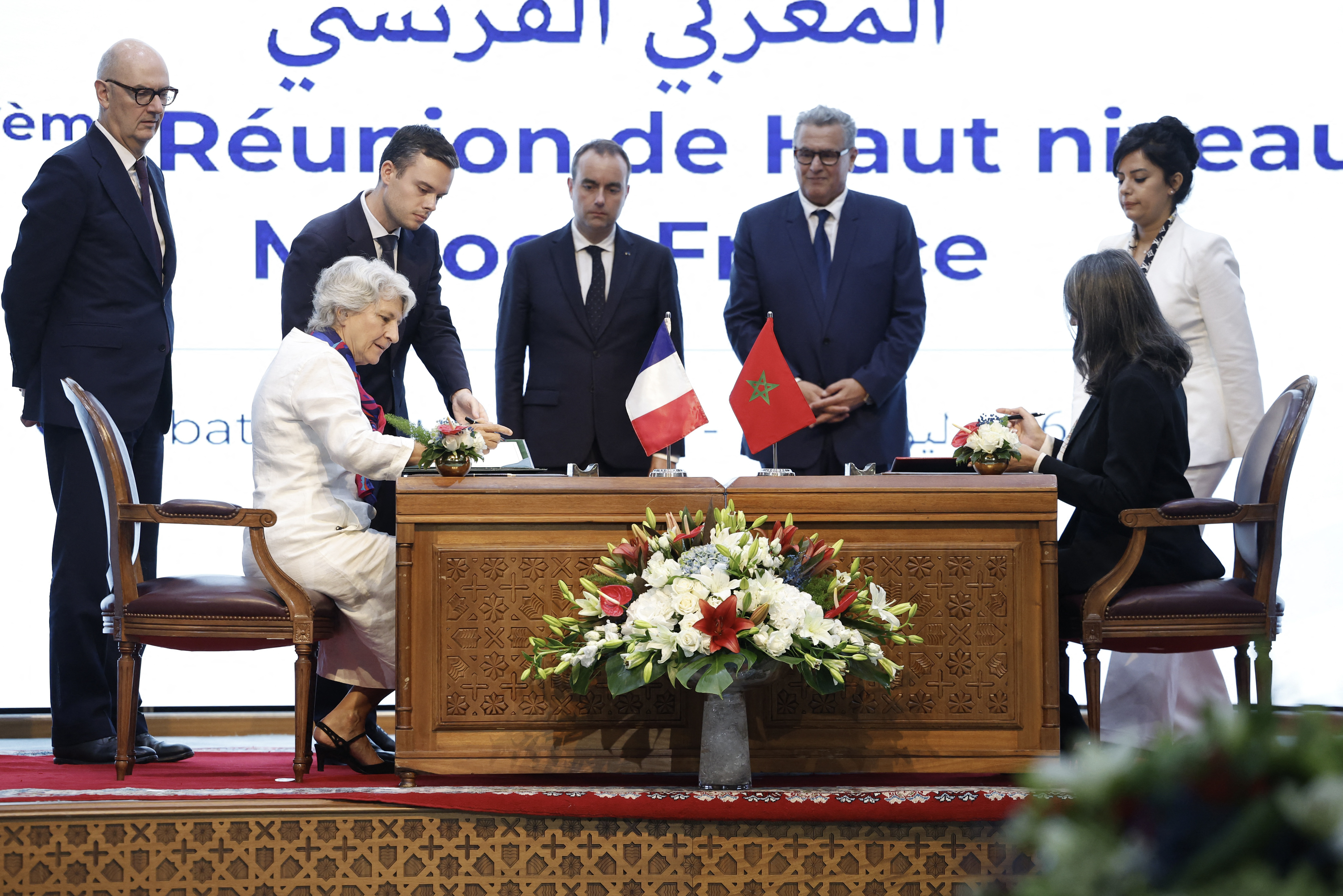 A signing ceremony between diplomats from France and Morocco