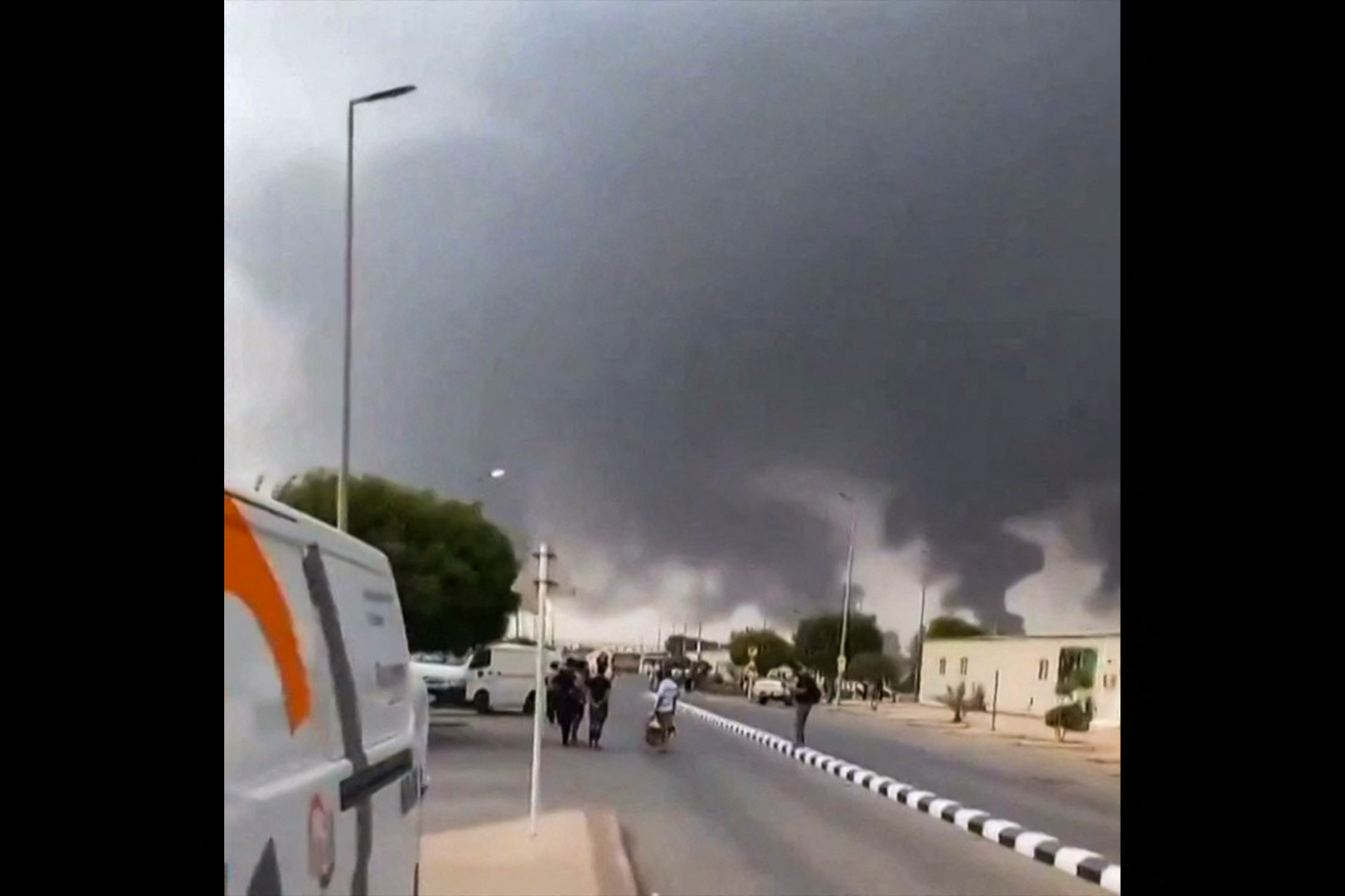 This screen grab taken on July 25, 2026 from an undated UGC video footage posted on social media and verified by AFPTV teams shows clouds of smoke rising after strikes on the Saudi Aramco refinery in Jizan.