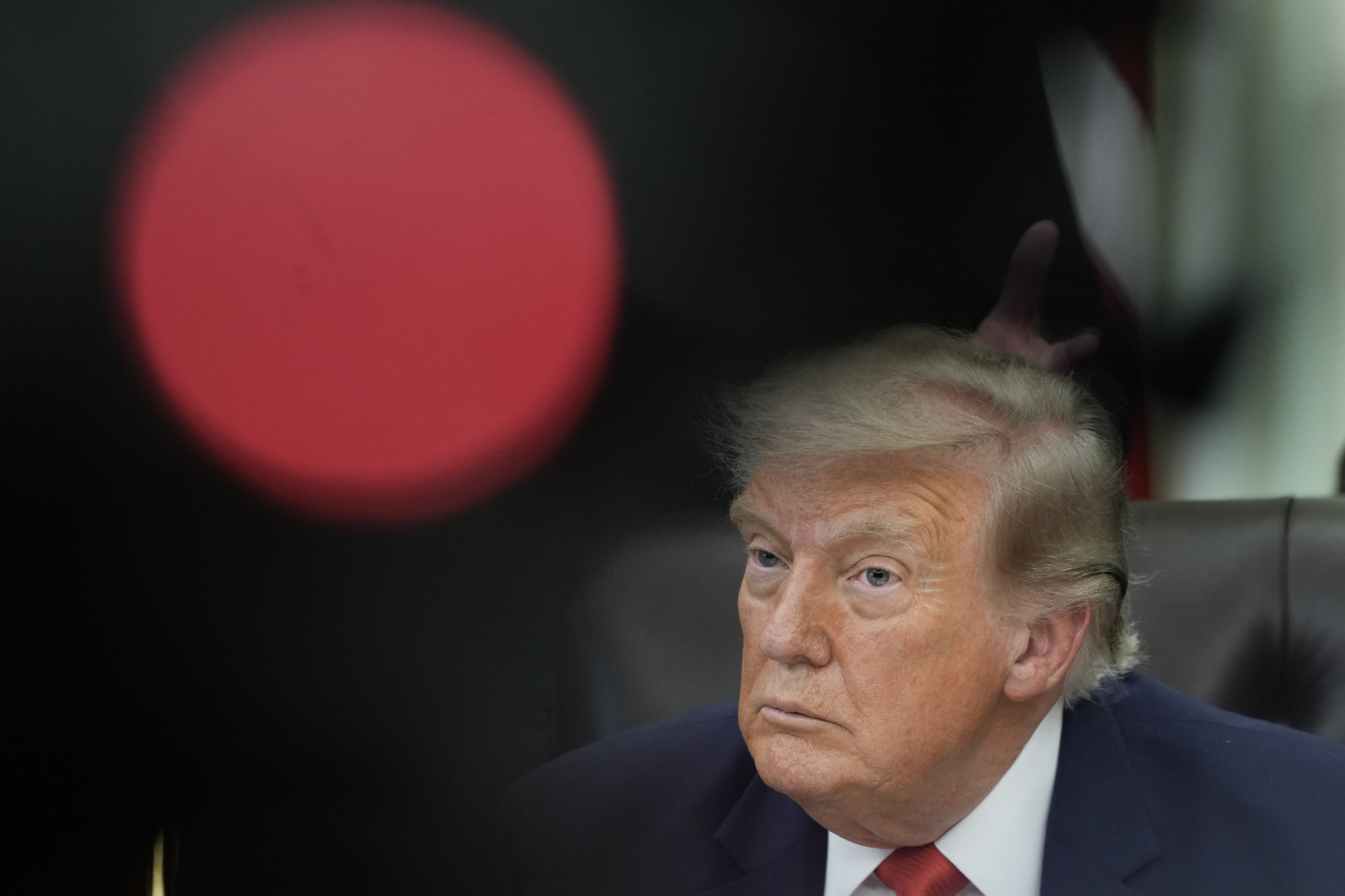 US President Donald Trump looks on during an announcement about Dulles International Airport renovations in the Oval Office of the White House in Washington, DC on July 29, 2026 [AFP]