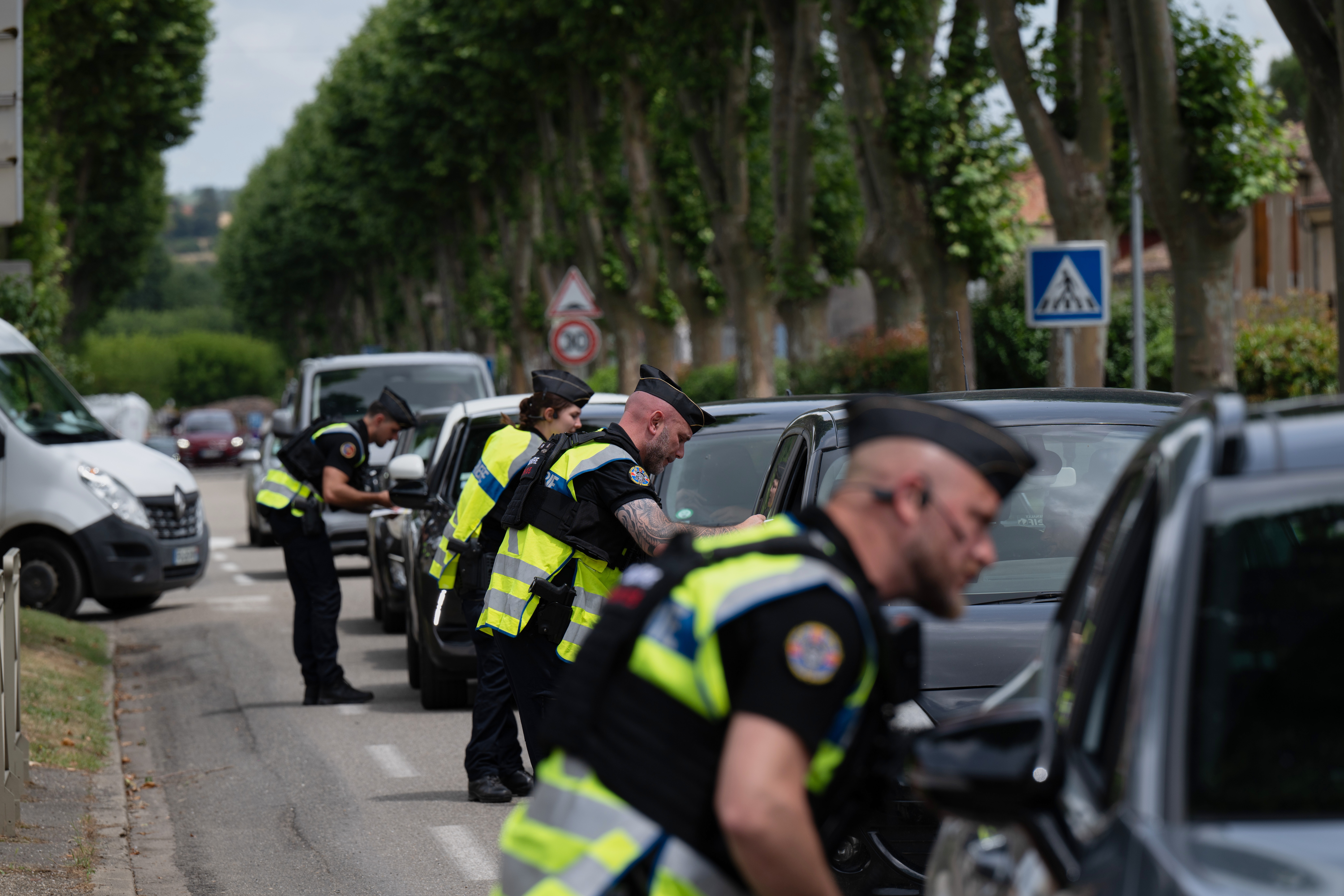 Police inspect vehicles during the search for evidence in the case of missing 11-year-old Lyhanna in Fleurance, southwestern France, Friday June 5, 2026. (AP Photo/Frederic Lancelot)