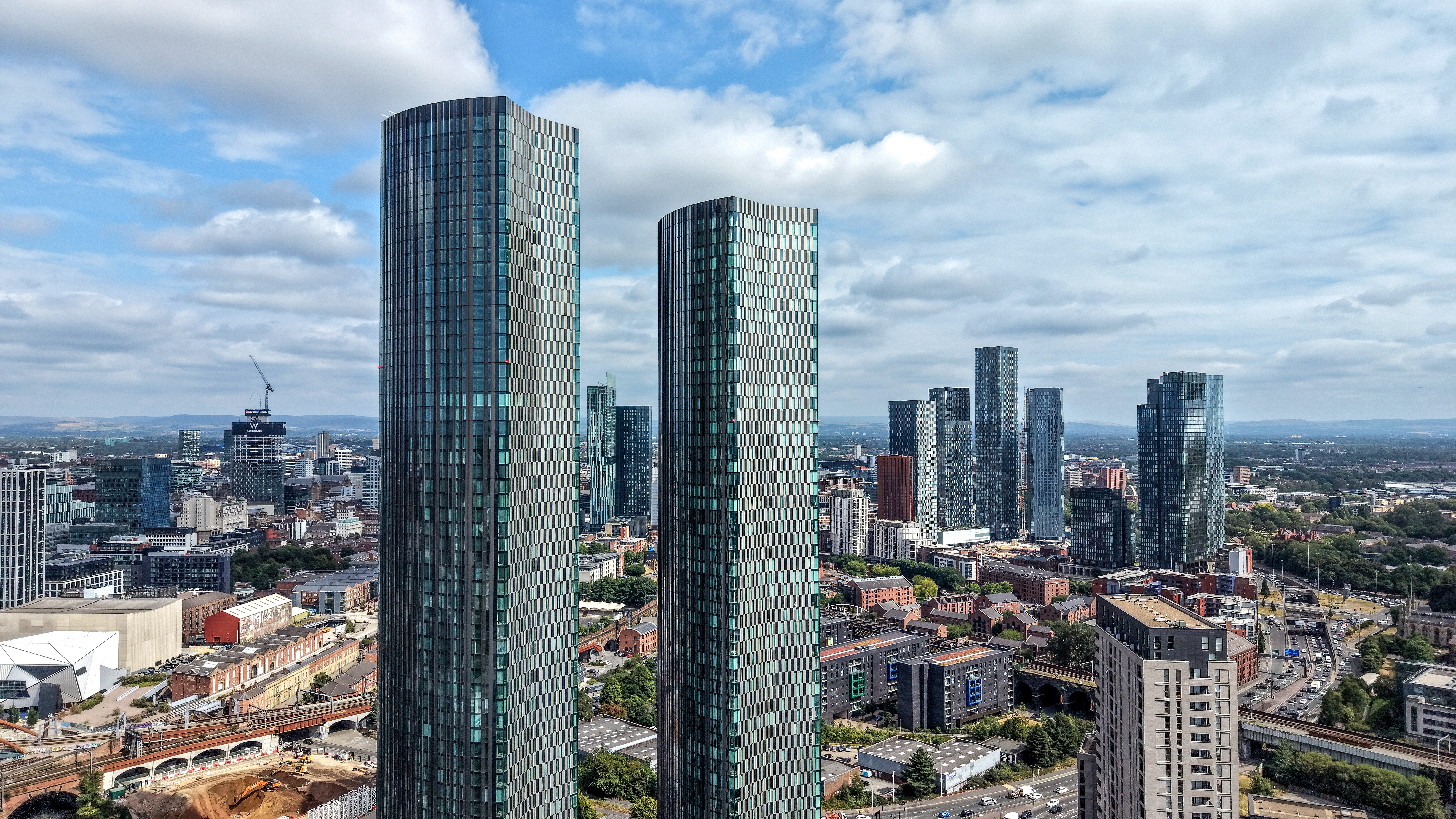 In this aerial view, recently constructed sky scrapers adorn the Manchester skyline on July 23, 2026 in Manchester, England. No 10 North will be based at Manchester’s Heron House in the interim and the government "Digital Campus" once it’s completed in 2032, as the new government under Prime Minister Andy Burnham seeks to establish No 10 North as “the dominant driver of the UK’s economy. (Photo by Christopher Furlong/Getty Images)