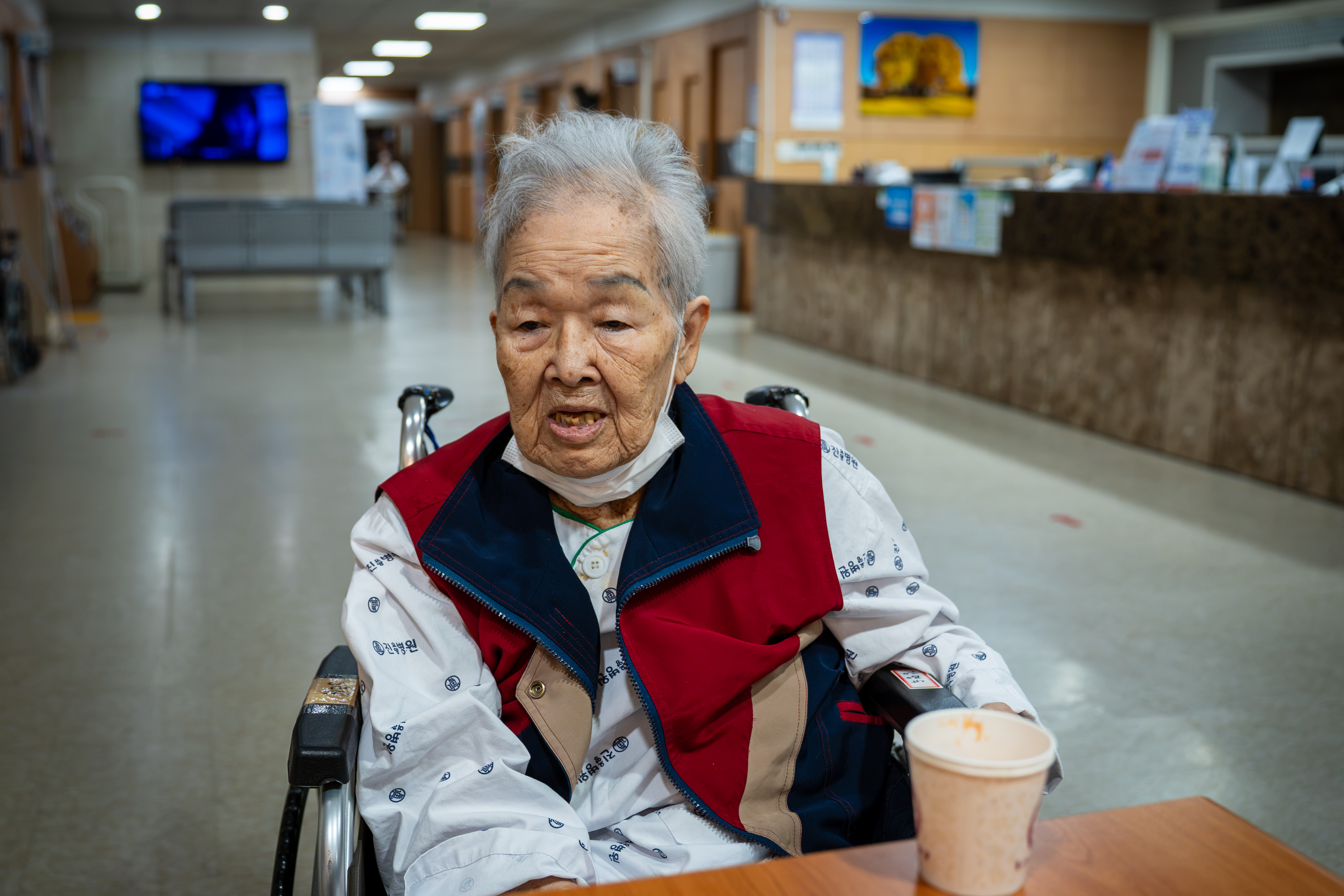 Kang Myung Sook, 87, speaks with Al Jazeera at her elderly care facility in rural South Korea [Ifang Bremer/Al Jazeera]