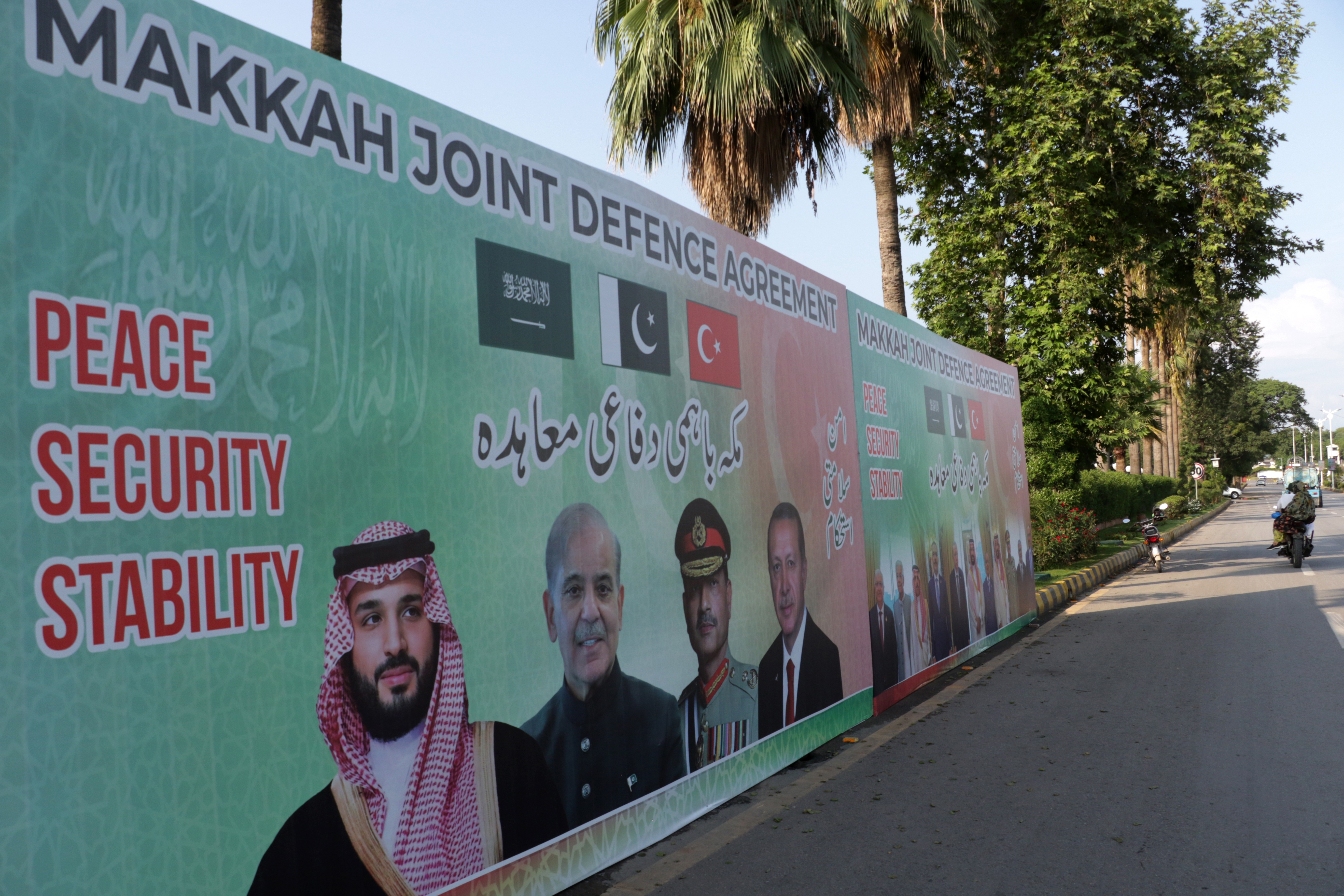 epa13157130 Billboards featuring Crown Prince and Prime Minister of the Kingdom of Saudi Arabia, Mohammed bin Salman; Pakistan's Prime Minister, Muhammad Shehbaz Sharif; Turkish President, Recep Tayyip Erdogan; and Pakistan's Chief of Army Staff, Field Marshal Asim Munir, are displayed on a road in Islamabad, Pakistan, 08 August 2026. Pakistan, Saudi Arabia, and Turkey signed a joint defense agreement during the Makkah Al-Mukarramah Summit for Joint Defense at Al-Safa Palace in Makkah, Saudi Arabia, on 07 August 2026. The pact stipulates that an armed attack against any one of the three countries will be regarded as an attack against all, strengthening collective deterrence and defense cooperation among the three states. EPA/SOHAIL SHAHZAD