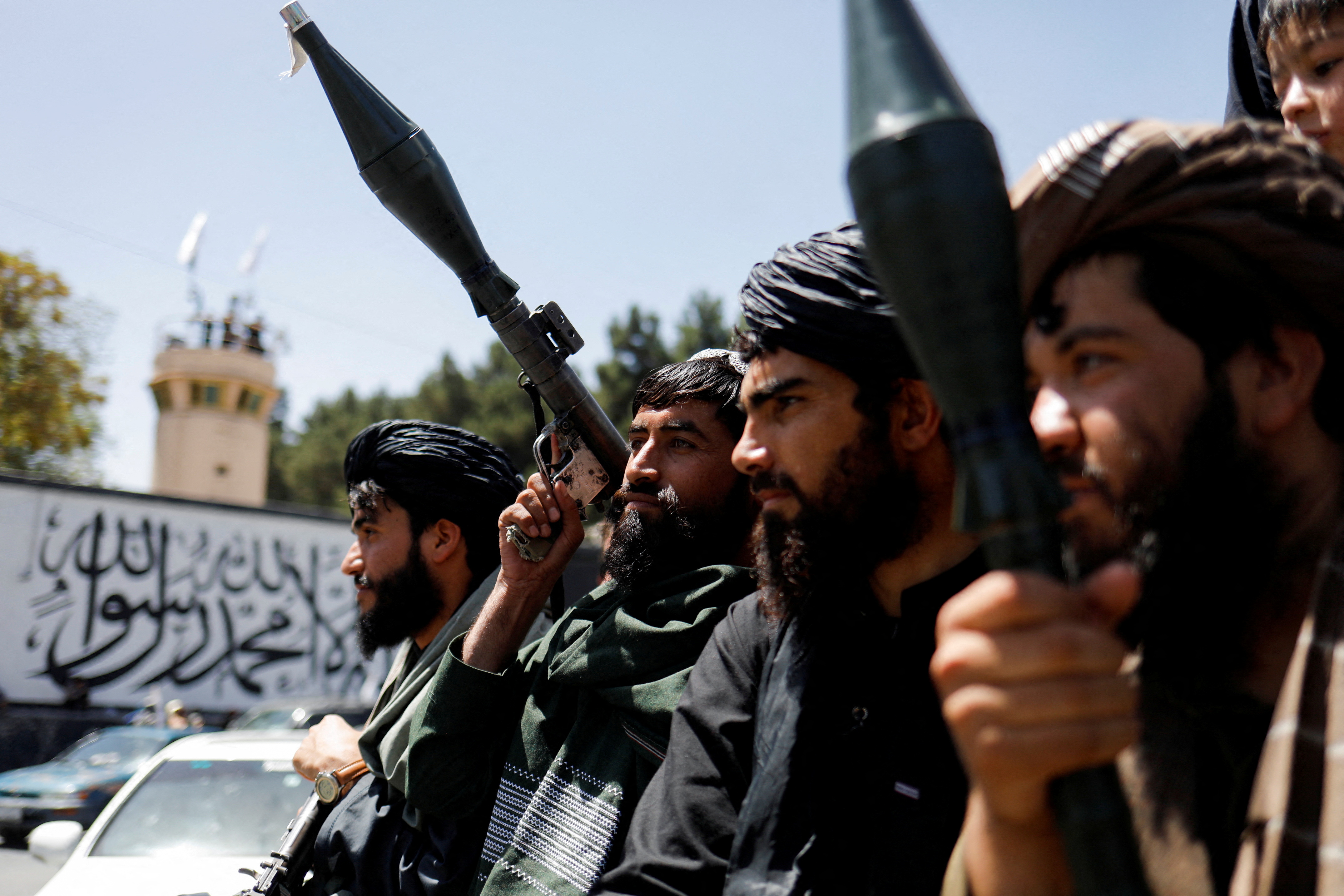 Taliban soldiers celebrate on the second anniversary of the fall of Kabul on a street near the US embassy in Kabul, Afghanistan, August 15, 2023. REUTERS/Ali Khara TPX IMAGES OF THE DAY