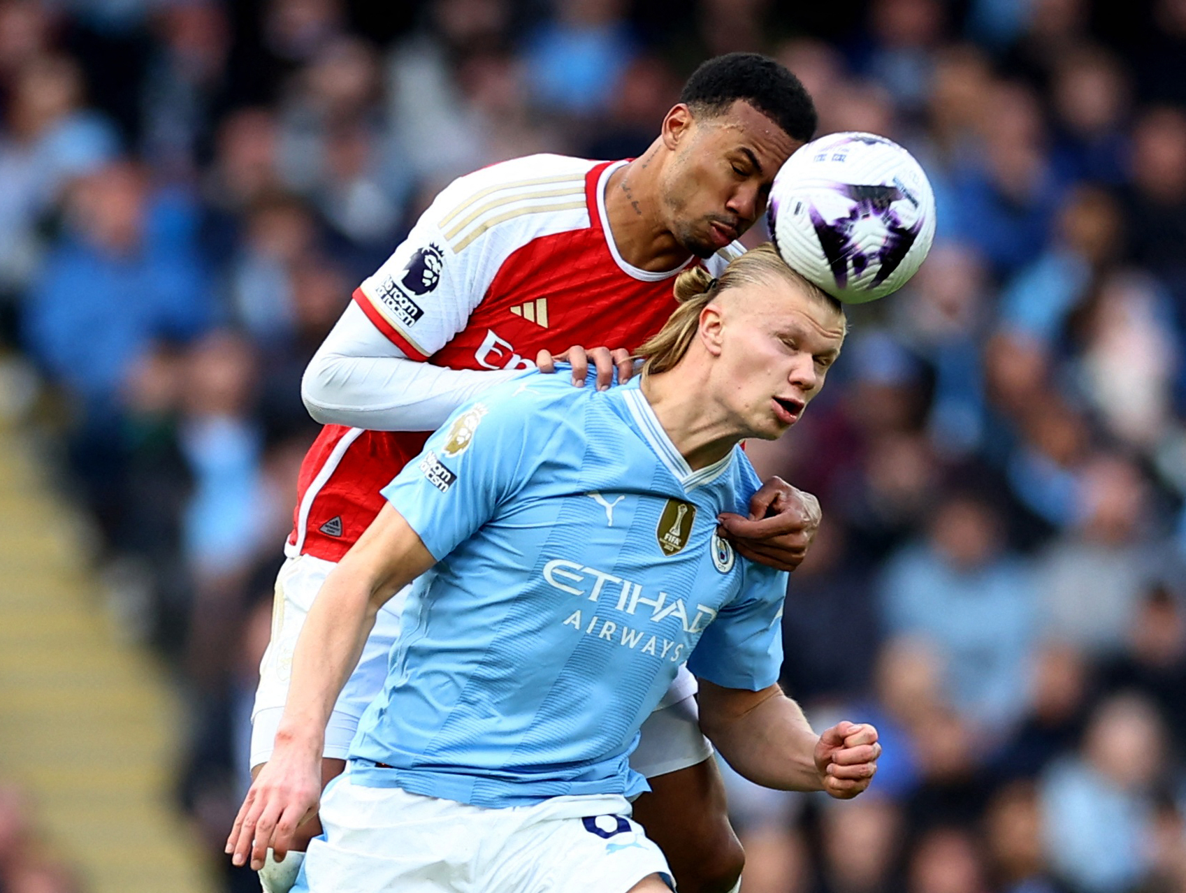 Arsenal's Gabriel in action with Manchester City's Erling Braut Haaland.