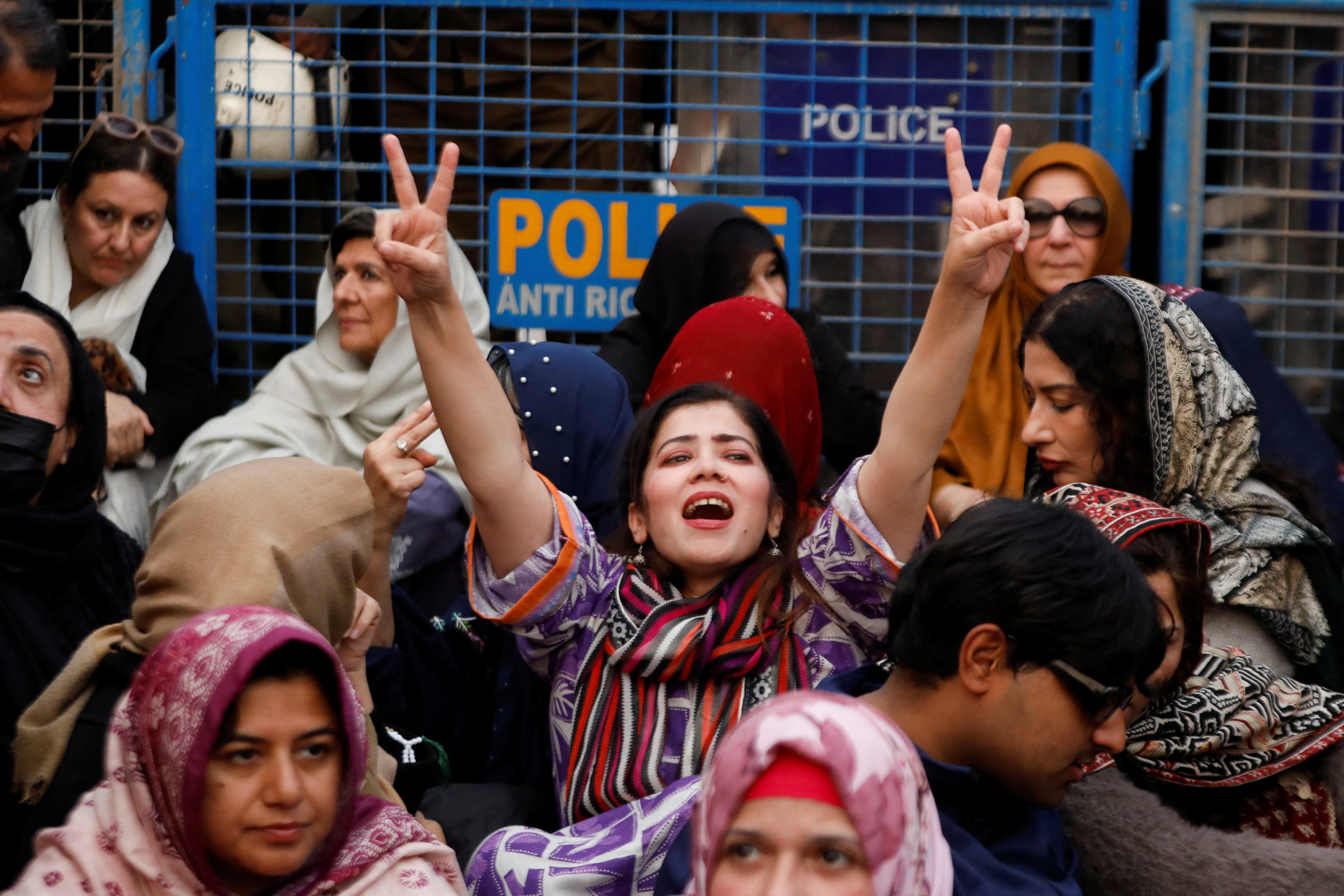 Supporters of jailed former Prime Minister of Pakistan and leader of Pakistan Tehreek-e-Insaf (PTI) party Imran Khan gather during a protest over concerns about their leader's health, on a road leading to Adiala jail in Rawalpindi, Pakistan, December 9, 2025. REUTERS/Salahuddin