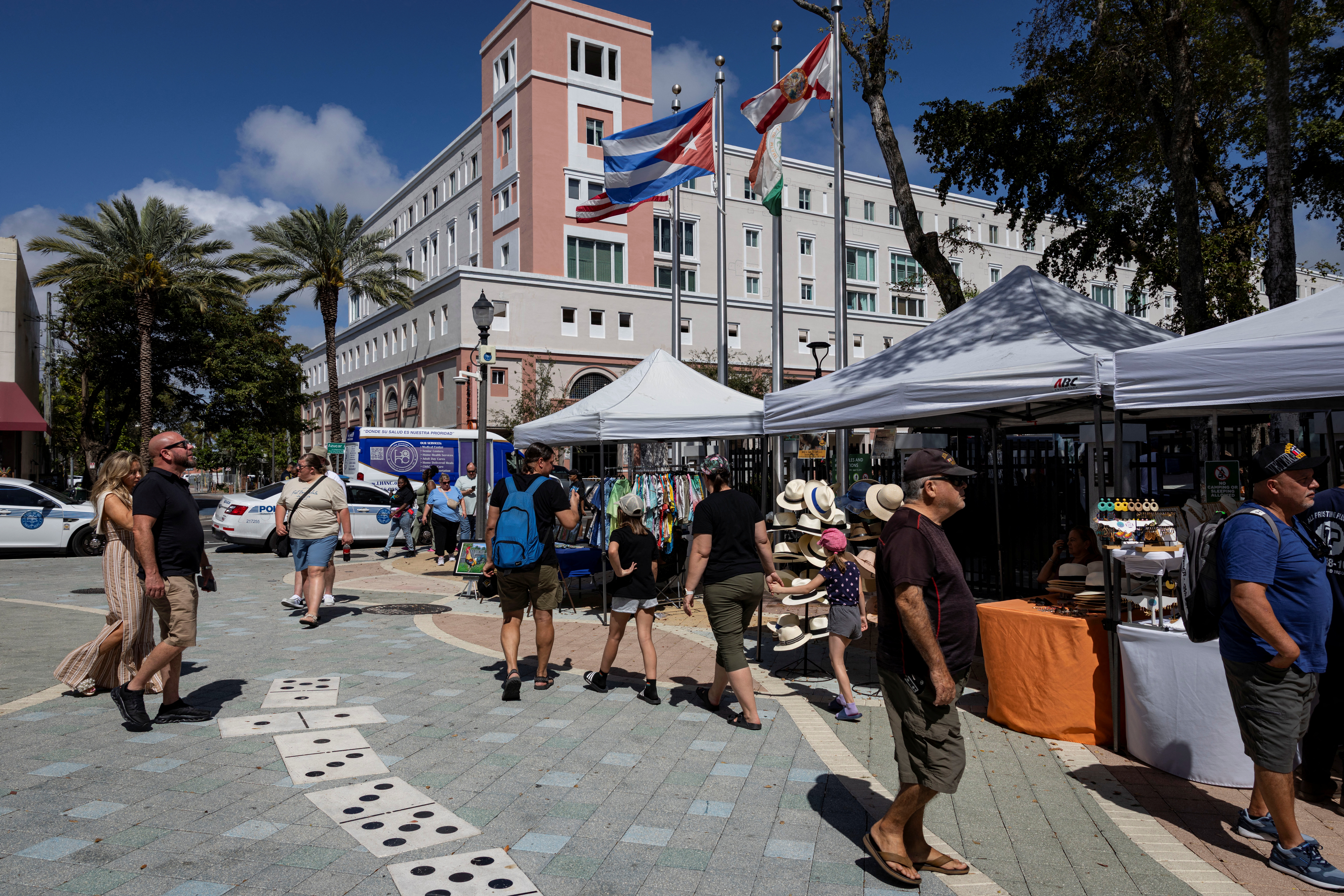 People walk past vendors at Calle Ocho in the Little Havana neighborhood in Miami, Florida, U.S., February 27, 2026. REUTERS/Eva Marie Uzcategui