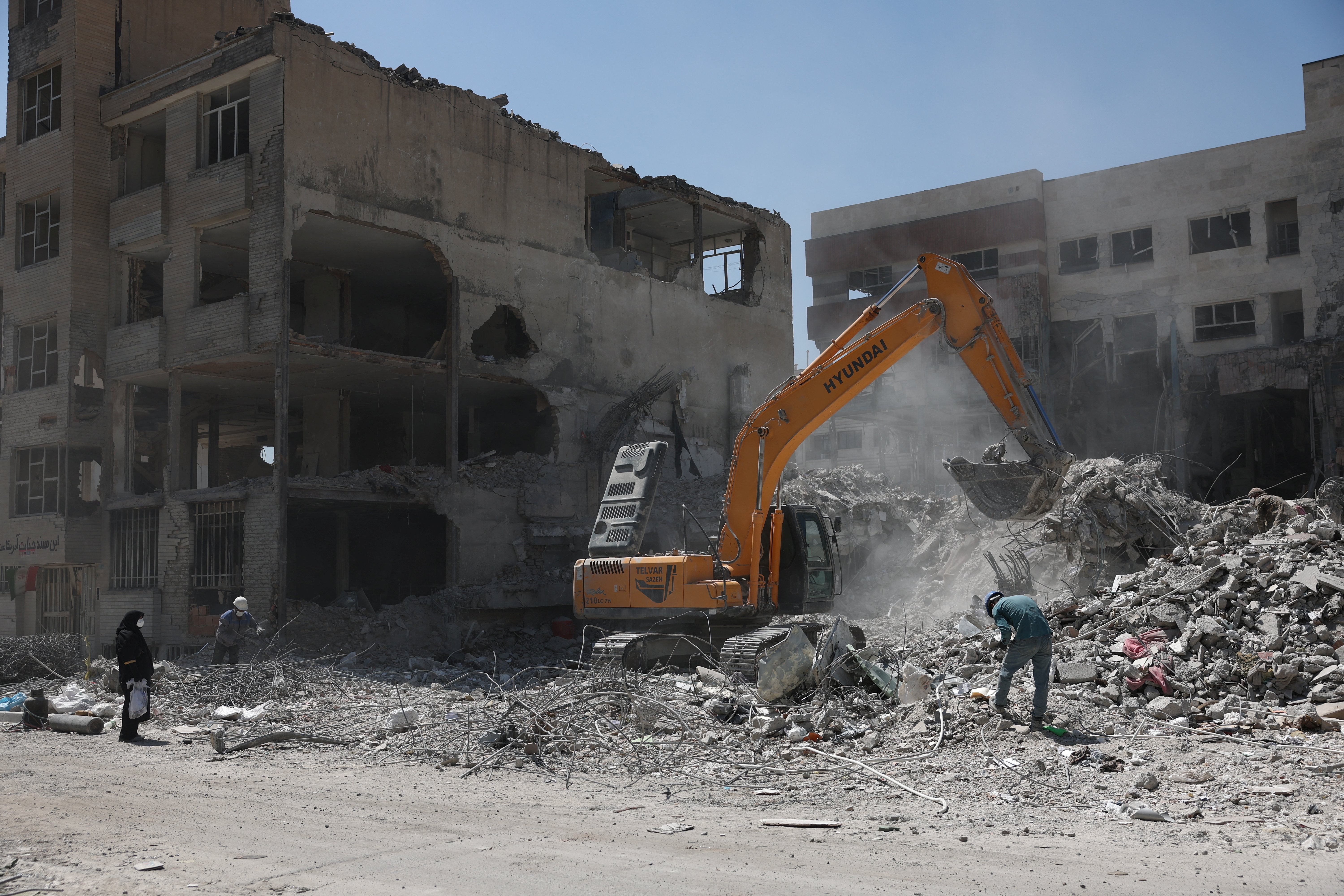 A machine operates near a residential building, which was damaged in a U.S. and Israeli strike in March, in Tehran, Iran June 7, 2026. Majid Asgaripour/WANA (West Asia News Agency) via REUTERS ATTENTION EDITORS - THIS PICTURE WAS PROVIDED BY A THIRD PARTY. ATTENTION EDITORS - THIS PICTURE WAS PROVIDED BY A THIRD PARTY. ISRAEL OUT. NO COMMERCIAL OR EDITORIAL SALES IN ISRAEL. NO ACCESS FOR ISRAELI MEDIA. NO USE BBC PERSIAN. NO USE VOA PERSIAN. NO USE MANOTO. NO USE IRAN INTERNATIONAL. NO USE RADIO FARDA. DIGITAL: NO USE BBC PERSIAN. NO USE VOA PERSIAN. NO USE MANOTO. NO USE IRAN INTERNATIONAL. NO USE RADIO FARDA.