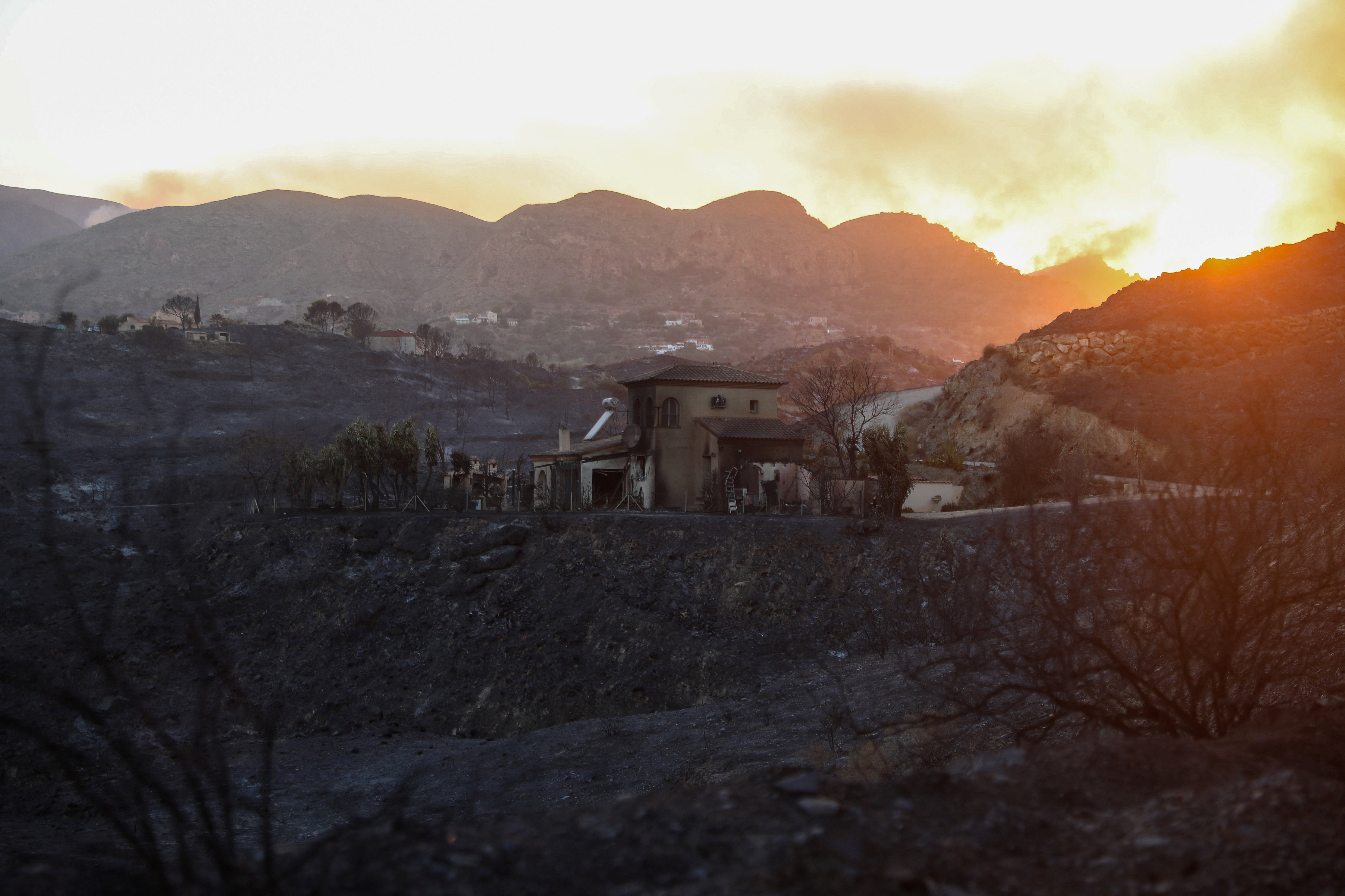 A damaged home remains amidst a burned area following deadly wildfires affecting Almeria province, in Bedar, Almeria, Spain, July 10, 2026. REUTERS/Loyola Perez de Villegas Muniz