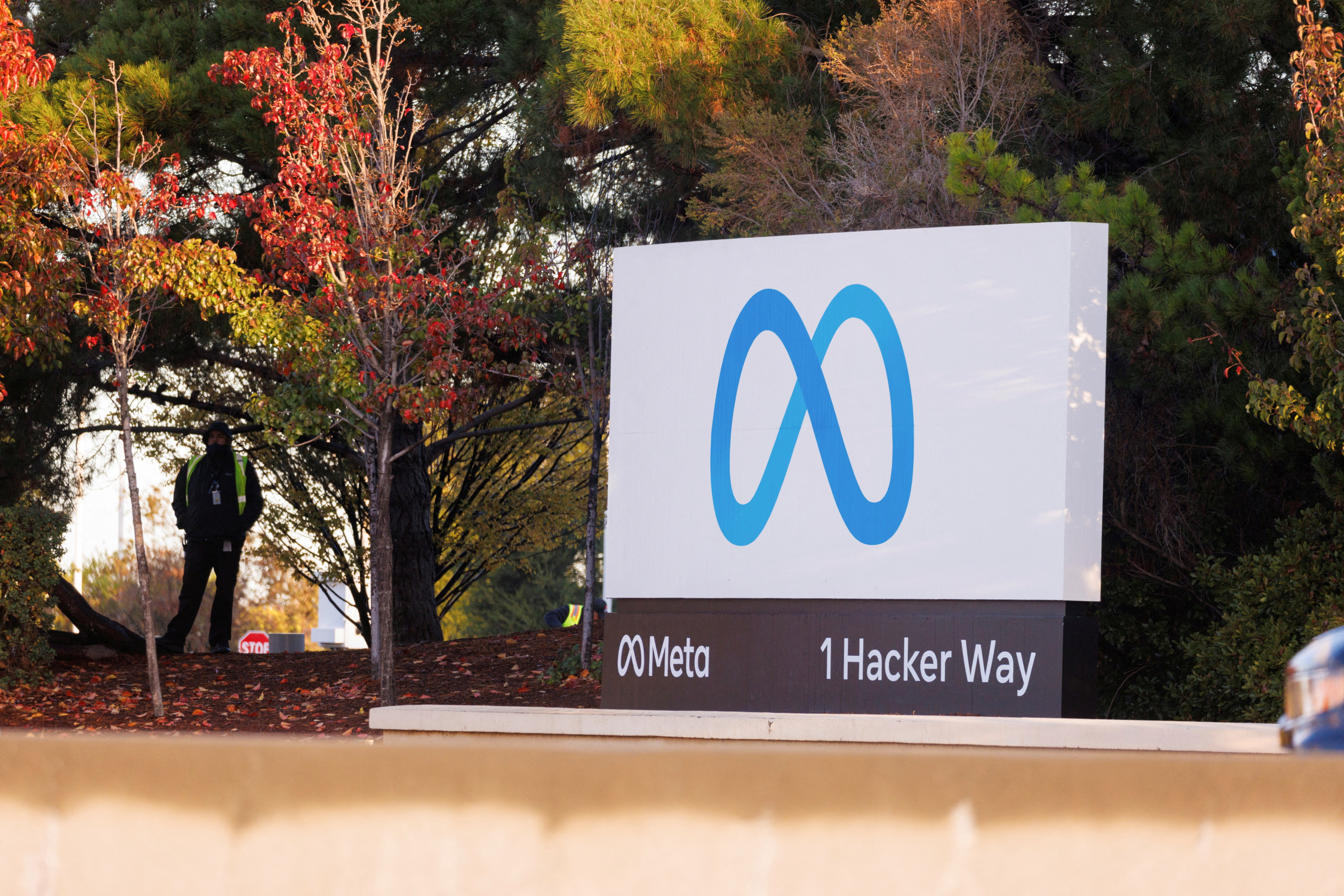 FILE PHOTO: A security guard stands watch by the Meta sign outside the headquarters of Facebook parent company Meta Platforms Inc in Mountain View, California, U.S. November 9, 2022. REUTERS/Peter DaSilva/File Photo