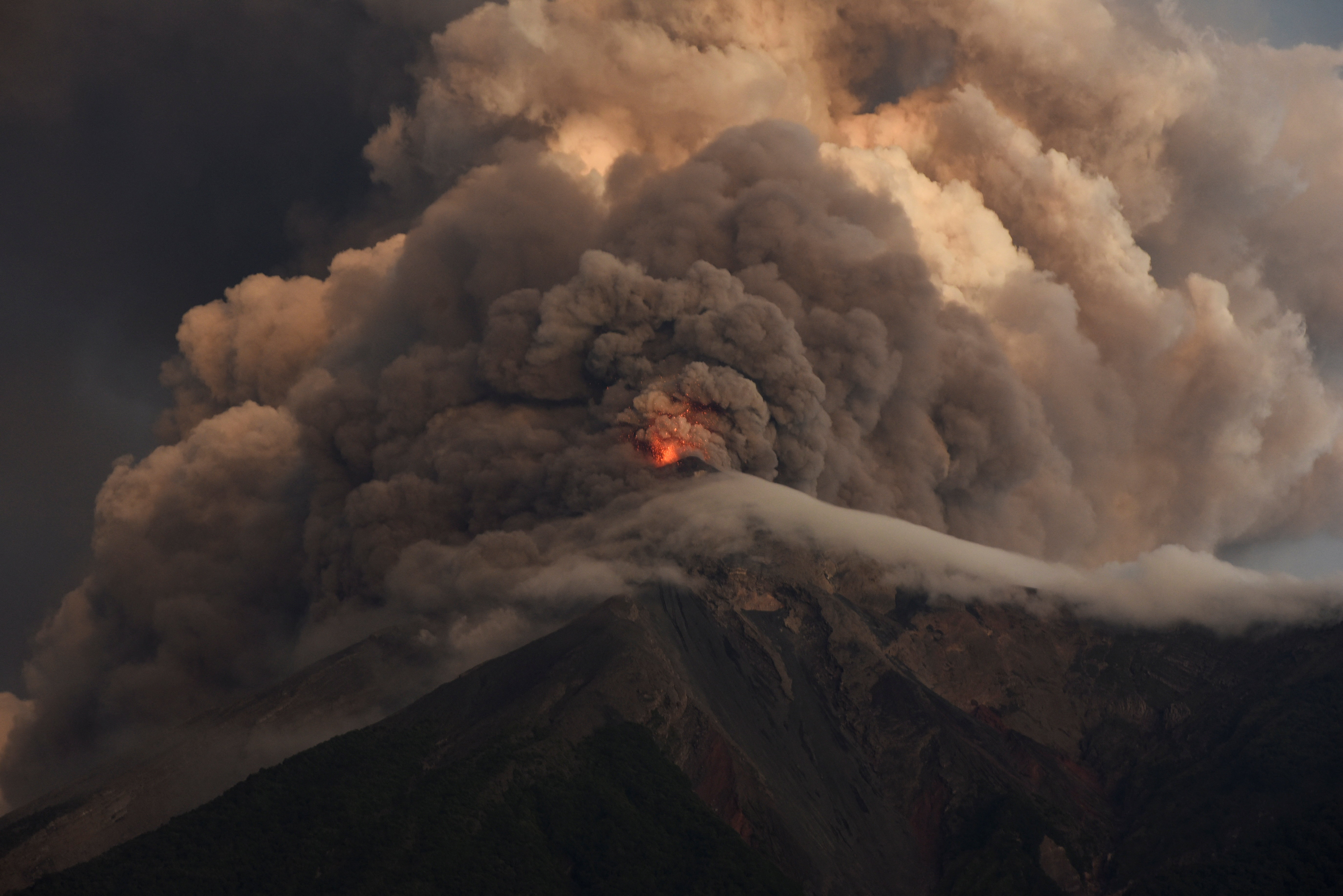 Lava flows out of the crater of the Fuego Volcano