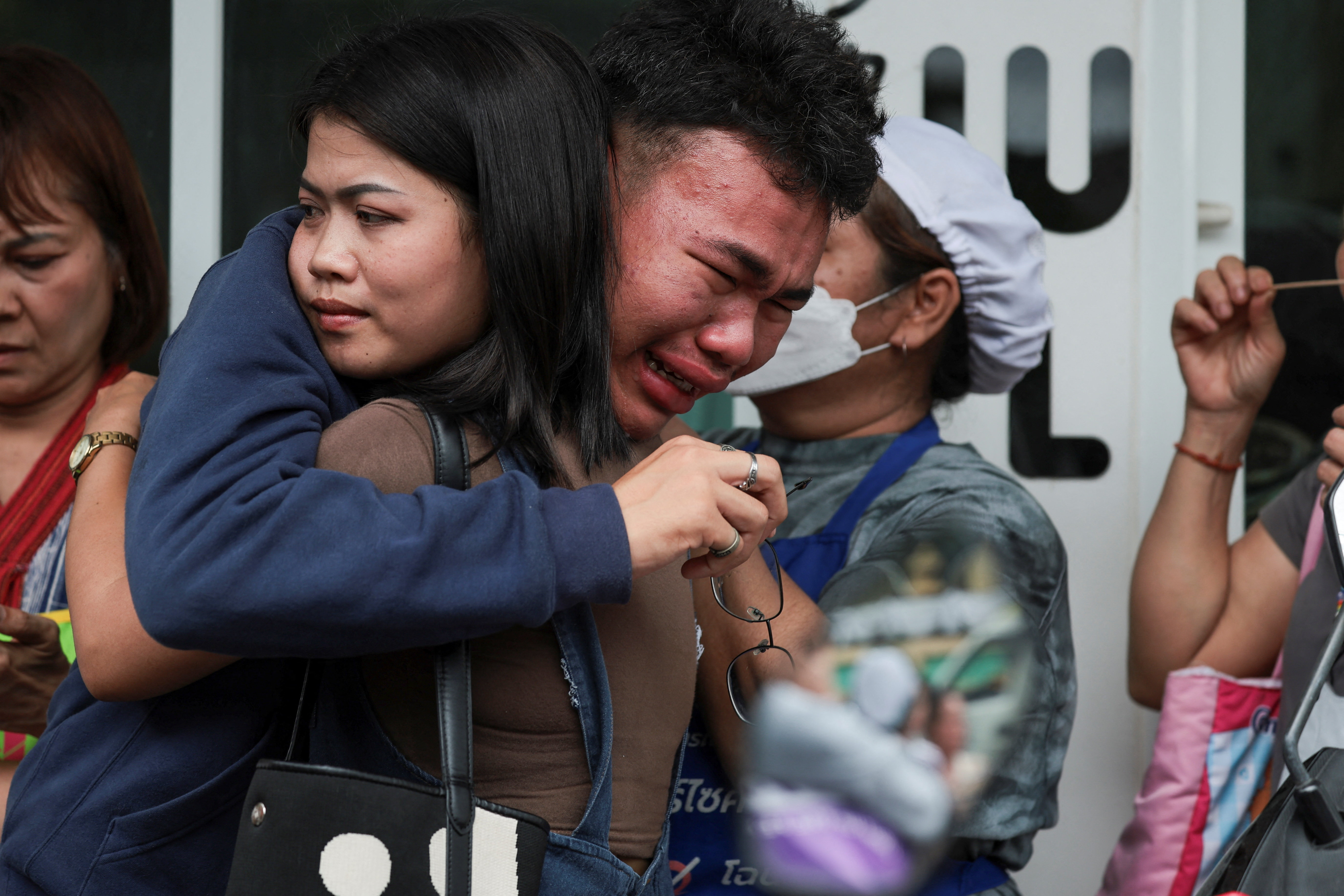 A student reacts after evacuating from Debsirin Nonthaburi School, following a shooting incident, in Bang Kruai district in Nonthaburi province on the outskirts of Bangkok, Thailand, August 7, 2026