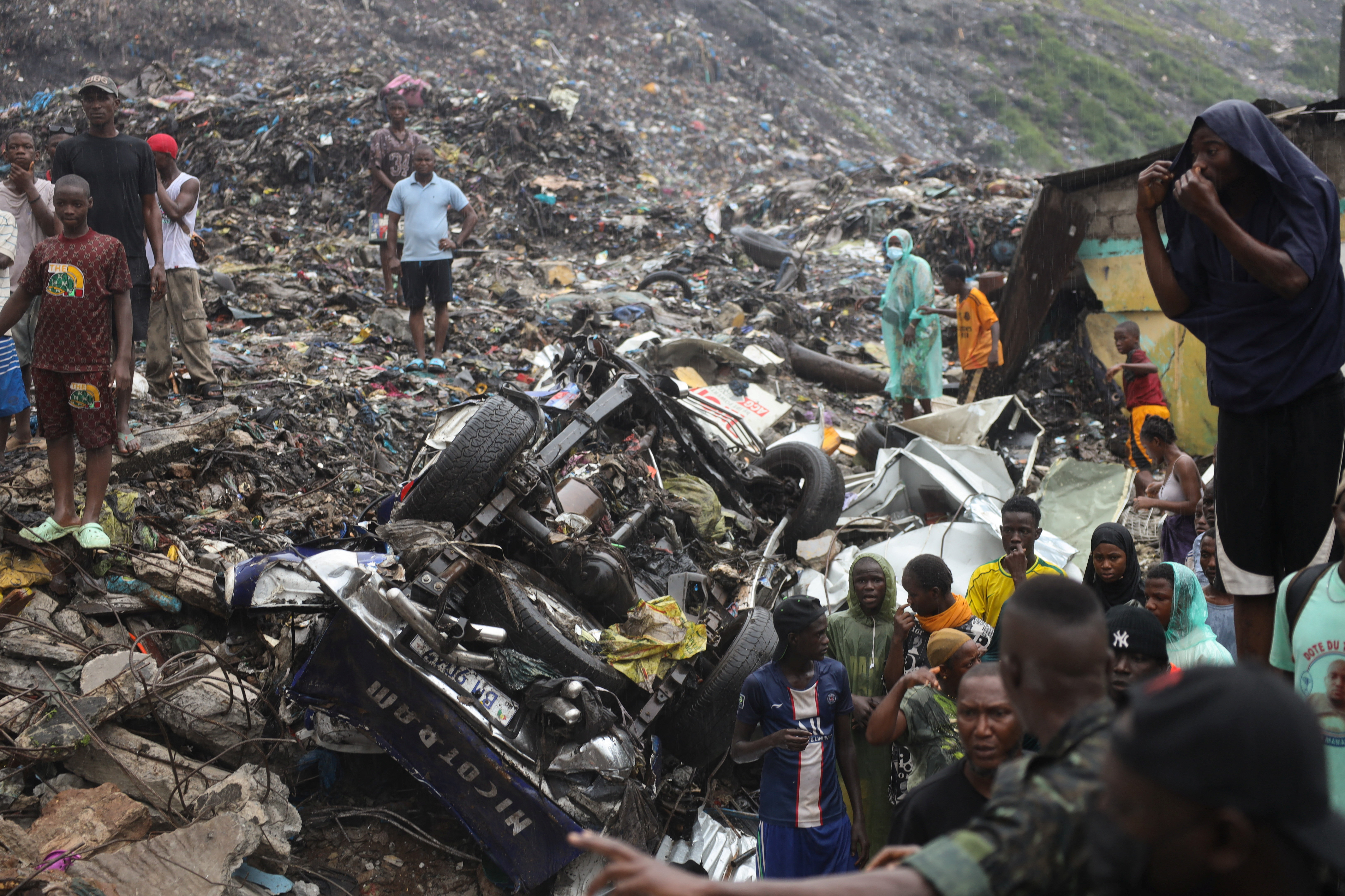 Guinea rescue workers dig for survivors after landfill collapse