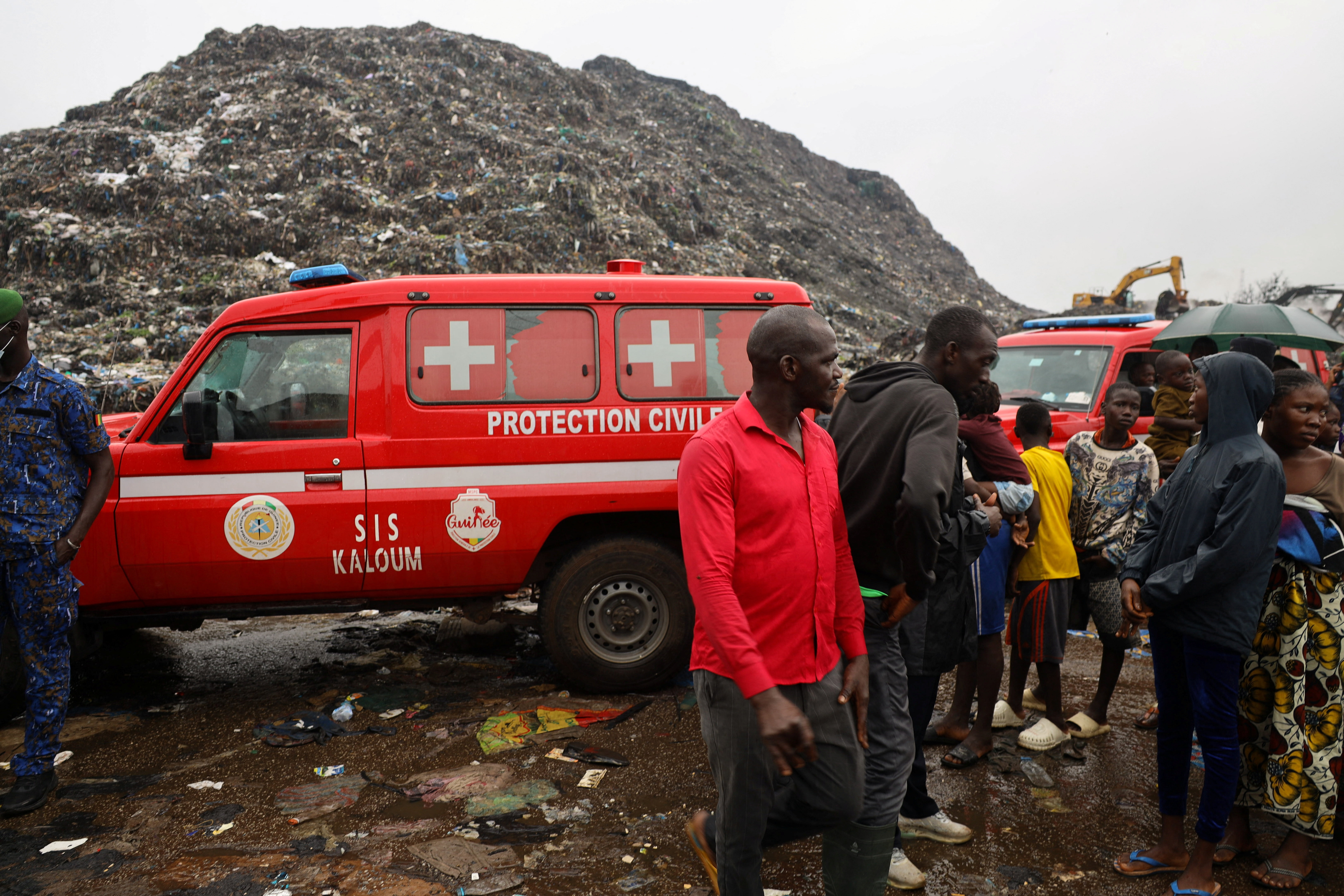 Guinea rescue workers dig for survivors after landfill collapse