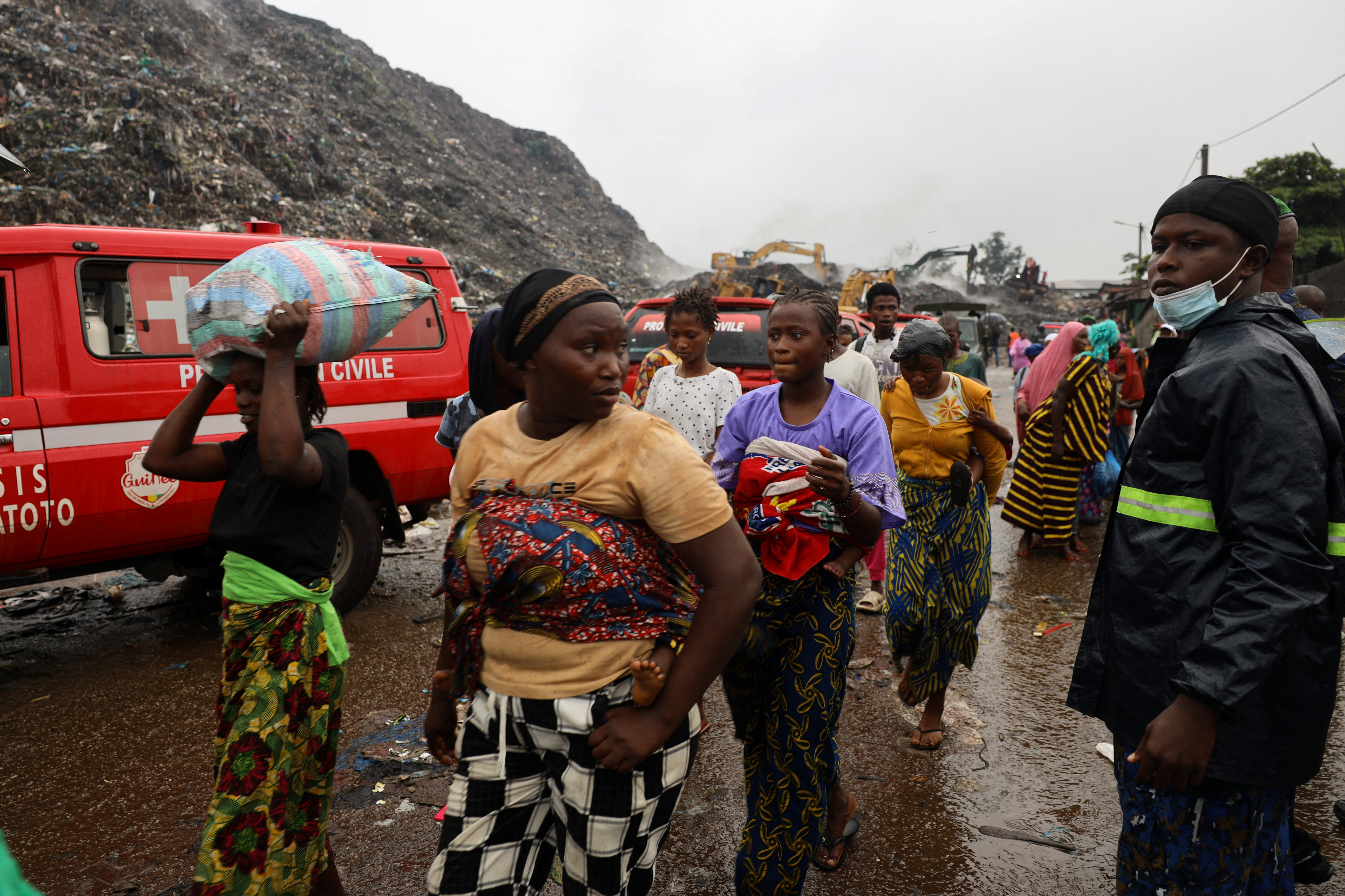 Guinea rescue workers dig for survivors after landfill collapse
