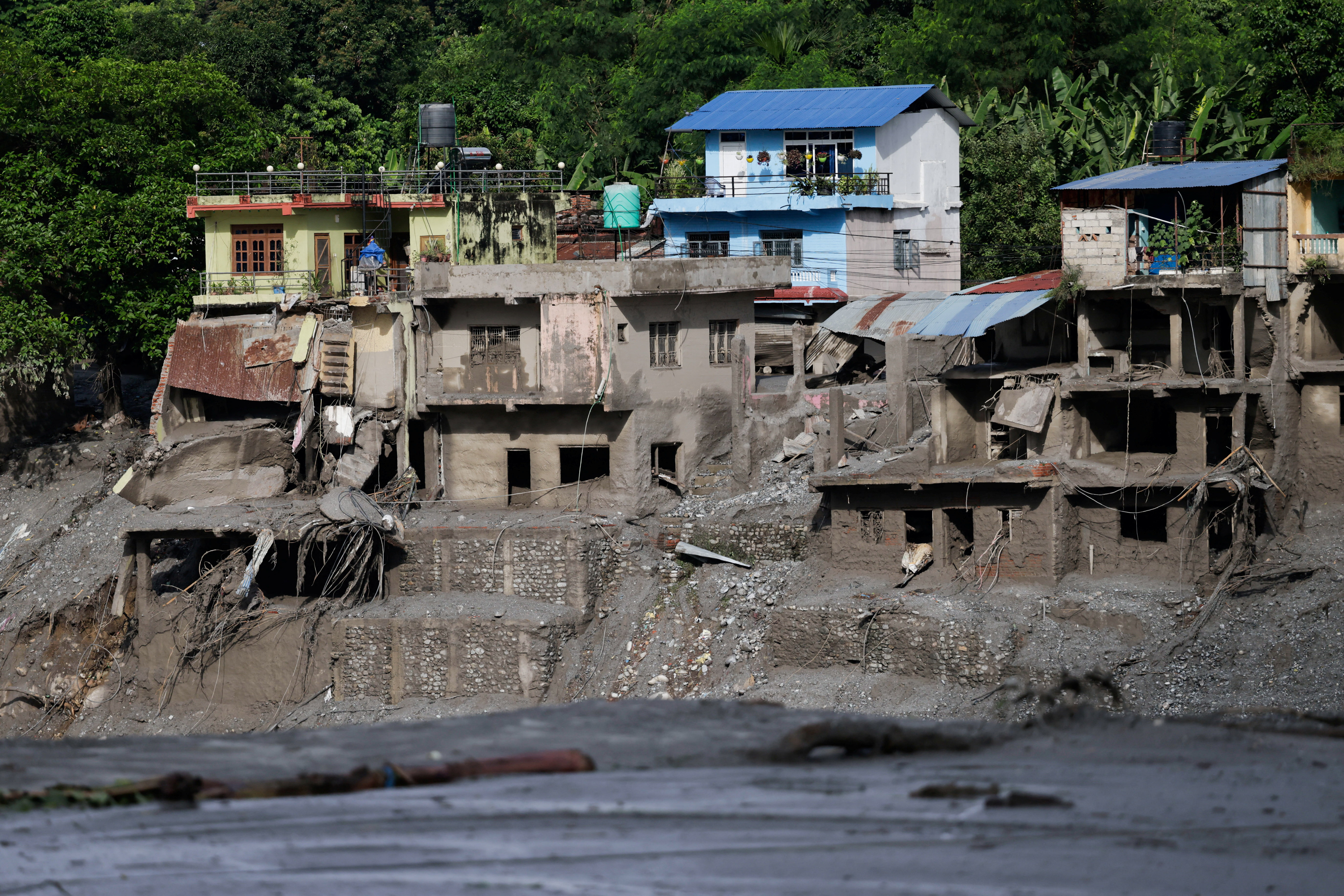 Damaged houses following devastating floods, in Trishuli in Nuwakot district, Nepal, on August 27, 2026. [Navesh Chitrakar/Reuters]