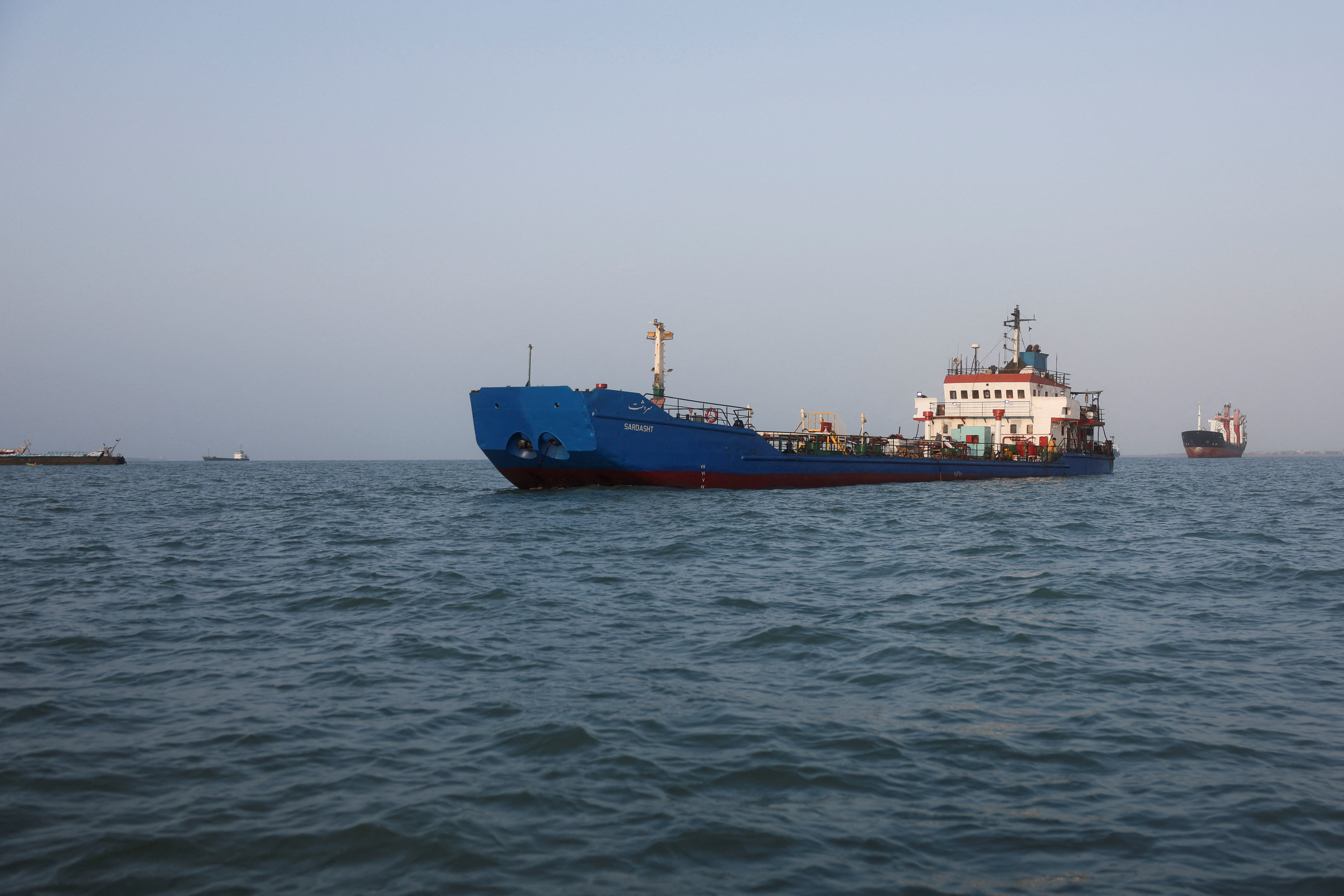 Vessels in the Strait of Hormuz are visible near the beach of Bandar Abbas, Iran, August 27, 2026. [Majid Asgaripour/WANA via Reuters]