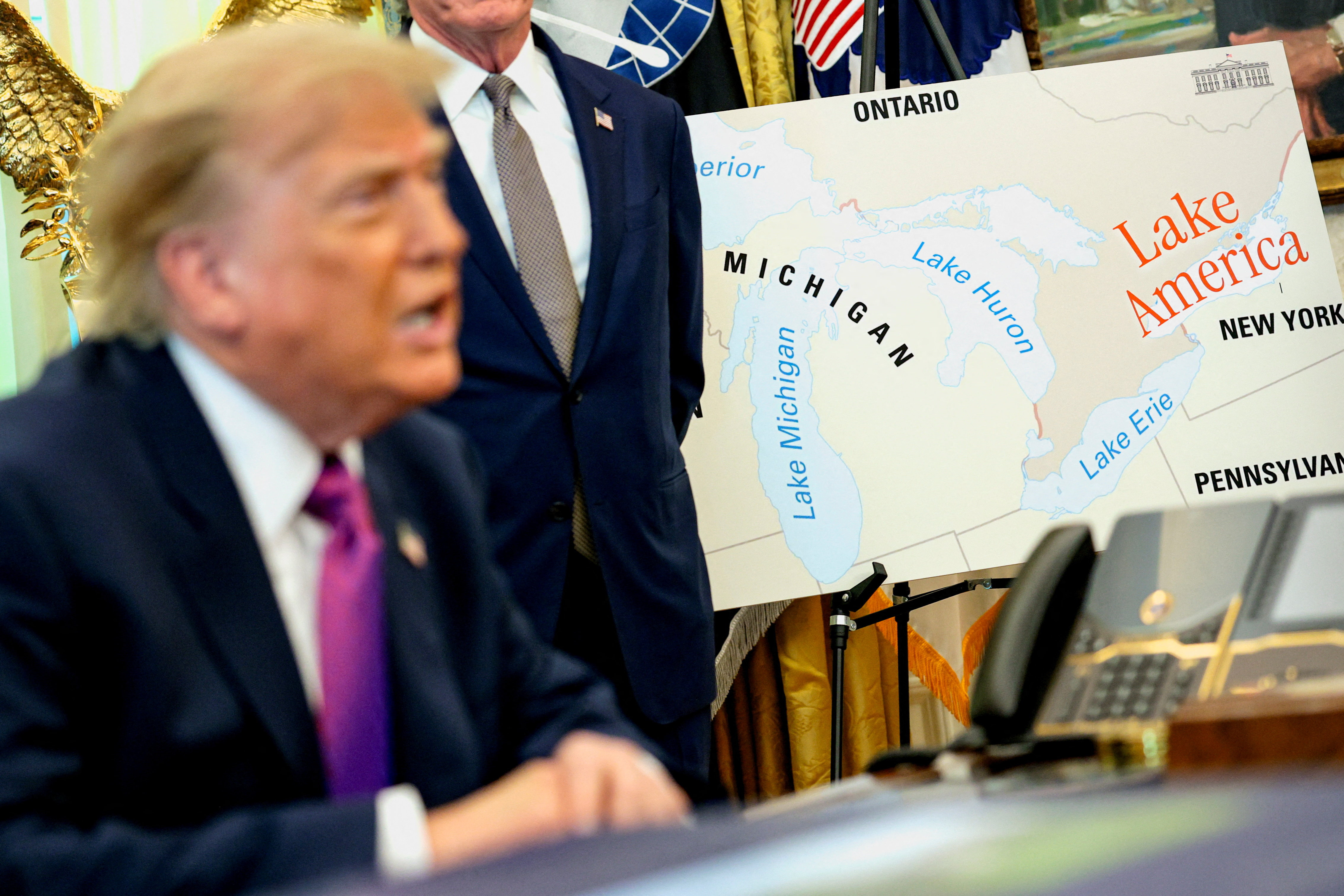US President Donald Trump speaks next to a map including ‘Lake America’ as he attends an event to sign an executive order renaming Lake Ontario at the Oval Office of the White House in Washington, DC, on August 27, 2026