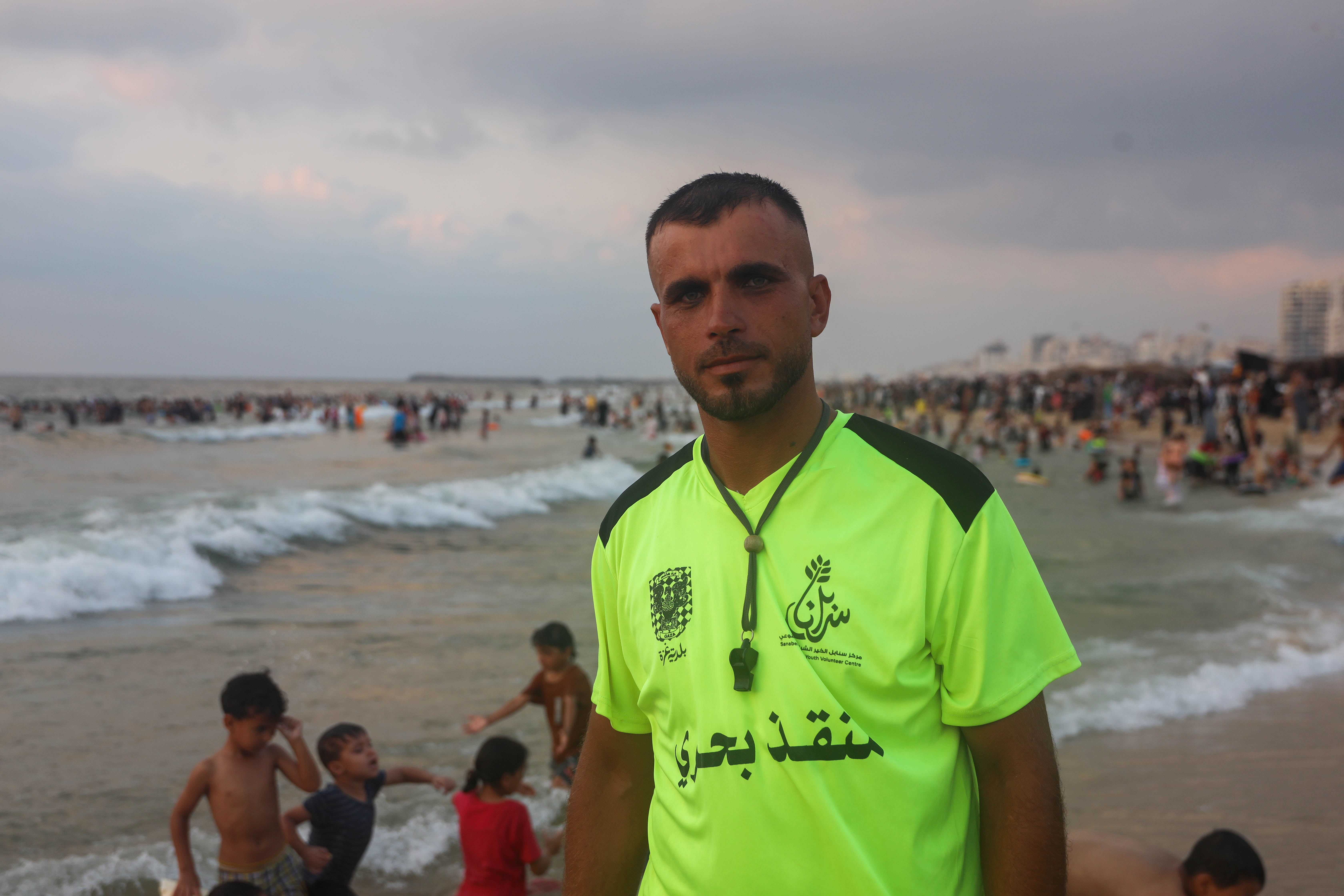 Bilal Bakar, a Gaza lifeguard for 15 years, watches over swimmers