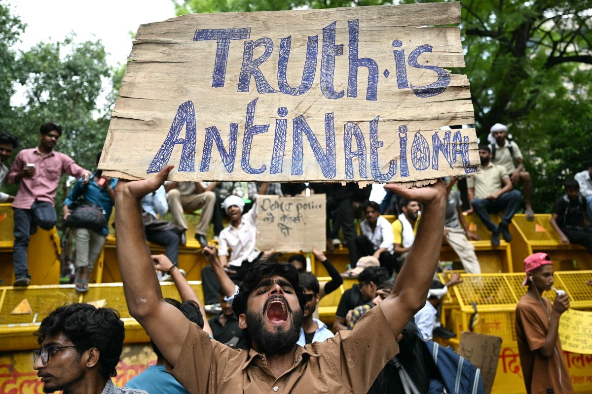 A Cockroach Janta Party (CJP) supporter shouts slogans at Jantar Mantar in New Delhi on July 23, 2026