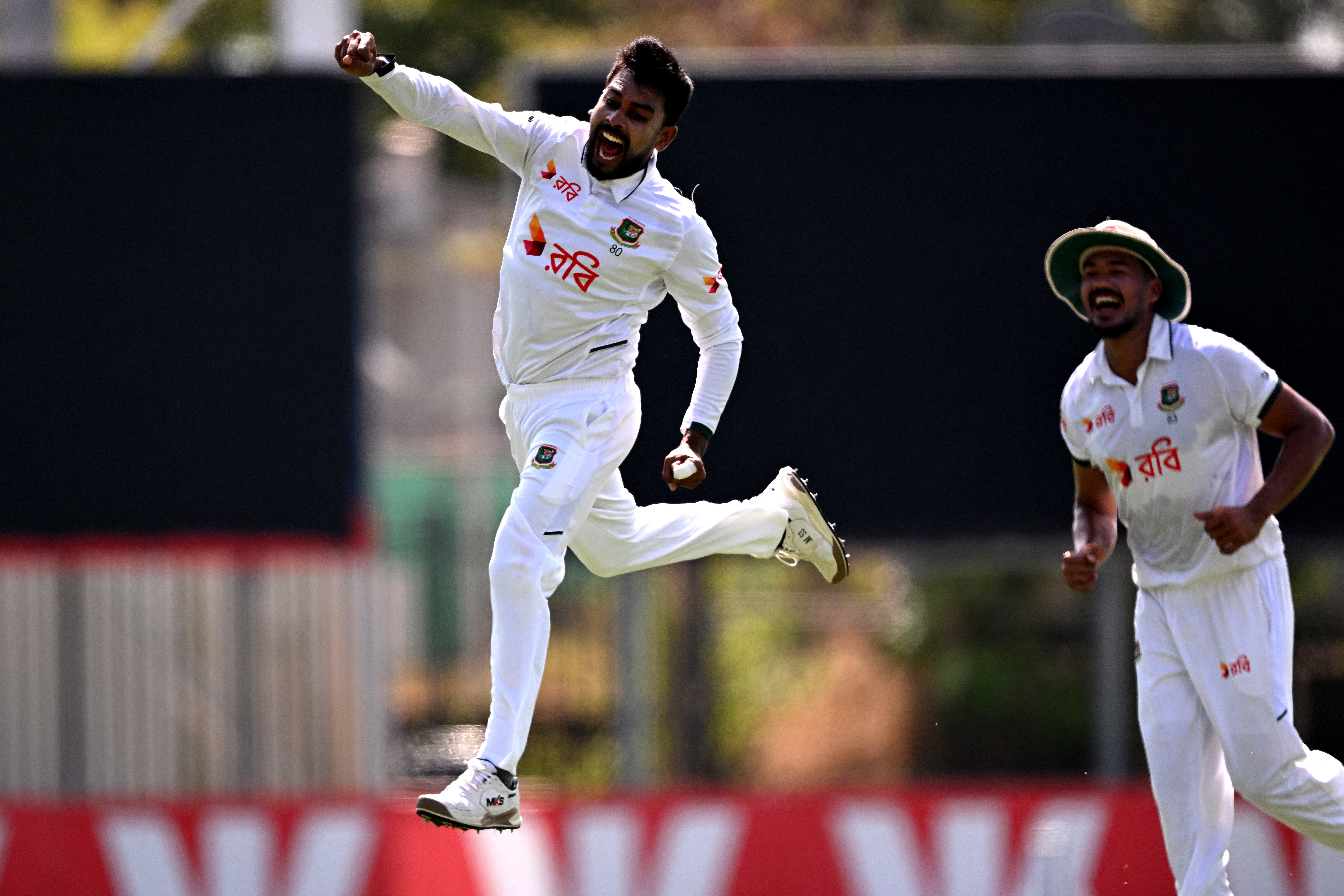 Bangladesh bowler Mehidy Hasan Miraz celebrates dismissing Australia's batsman Beau Webster on the fourth day of the first cricket Test match between Australia and Bangladesh at Marrara Stadium in Darwin on August 16, 2026. (Photo by William WEST / AFP) / --IMAGE RESTRICTED TO EDITORIAL USE - STRICTLY NO COMMERCIAL USE--