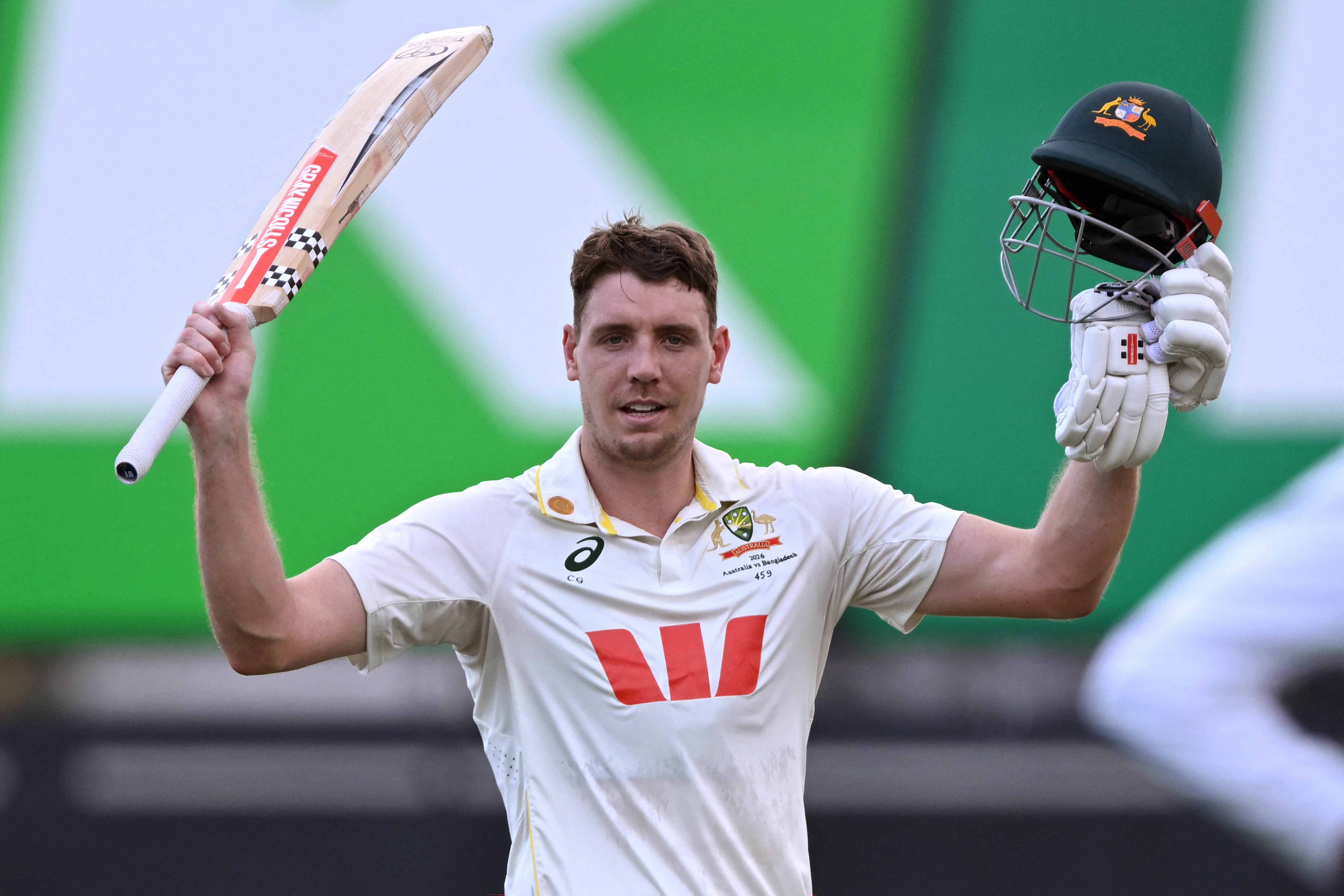 Australia's batsman Cameron Green celebrates scoring his century on the fourth day of the first cricket Test match between Australia and Bangladesh at Marrara Stadium in Darwin on August 16, 2026. (Photo by William WEST / AFP) / --IMAGE RESTRICTED TO EDITORIAL USE - STRICTLY NO COMMERCIAL USE--