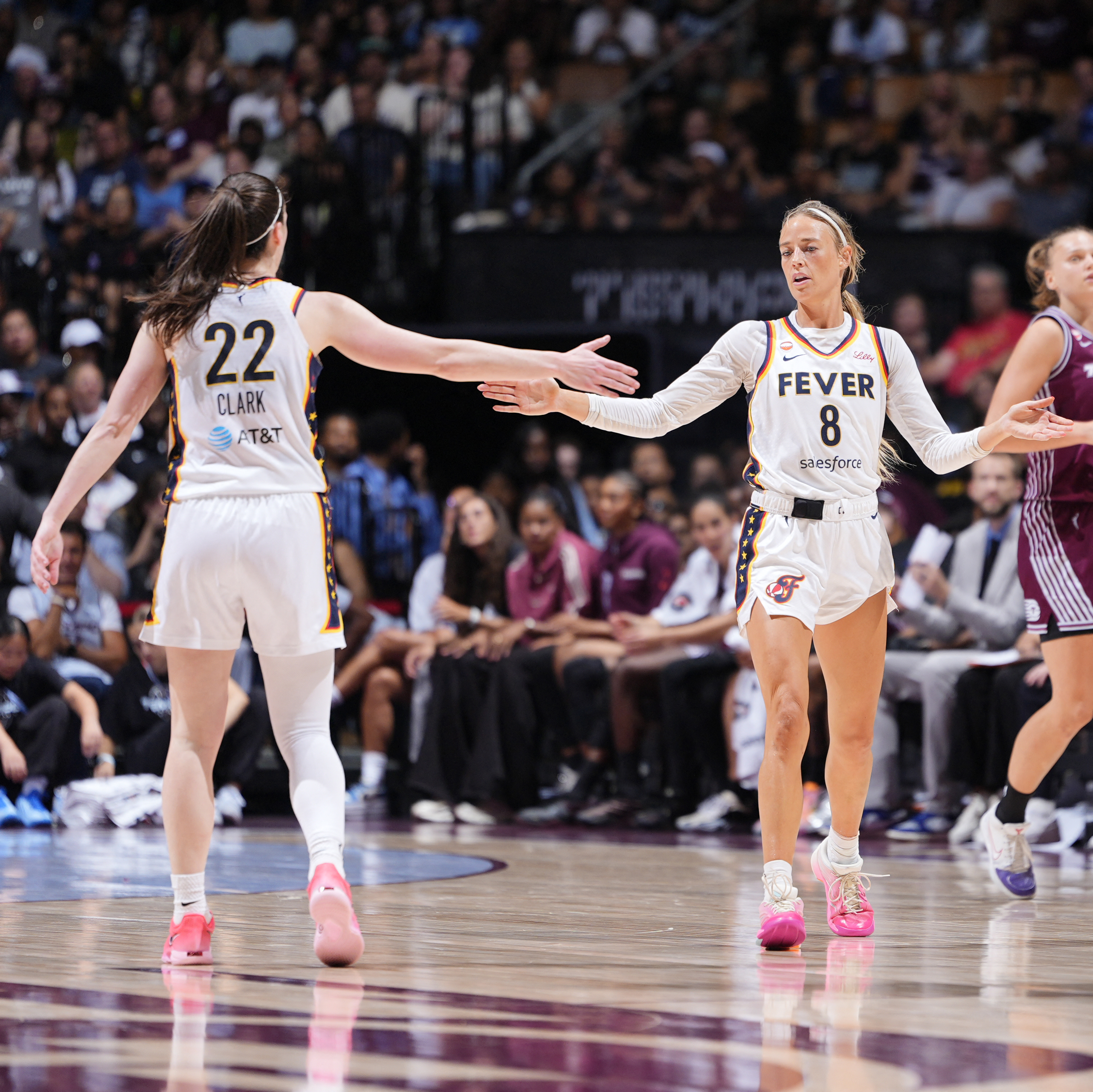 Caitlin Clark, left, and Sophie Cunningham of the Indiana Fever high five during the game against the Toronto Tempo on August 18, 2026 at Scotiabank Arena in Toronto, Canada