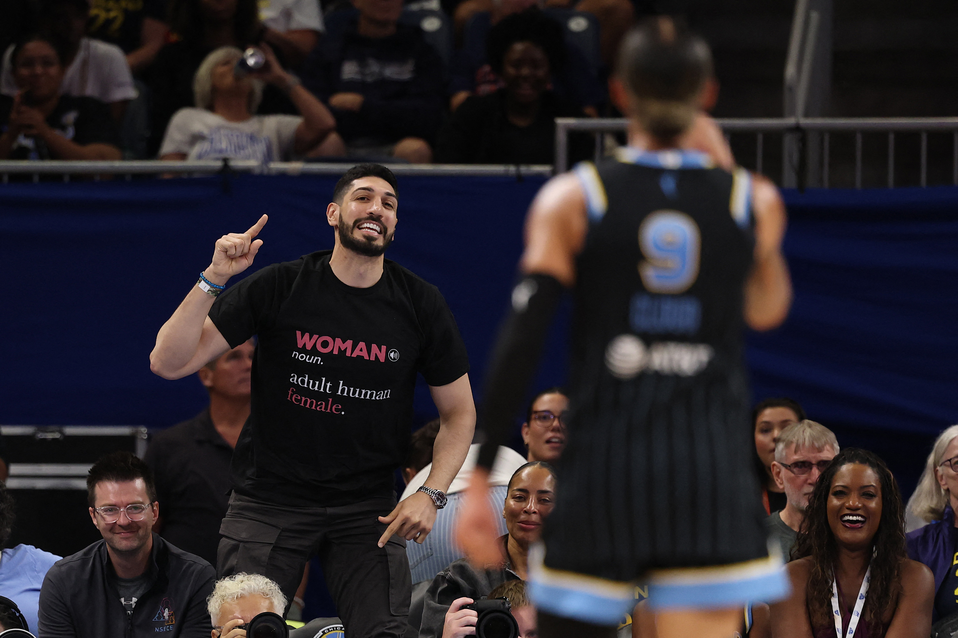 CHICAGO, ILLINOIS - AUGUST 23: Former basketball player Enes Kanter Freedom and Natasha Cloud #9 of the Chicago Sky yell at one another during the second half between the Chicago Sky and the Indiana Fever at Wintrust Arena on August 23, 2026 in Chicago, Illinois. NOTE TO USER: User expressly acknowledges and agrees that, by downloading and or using this photograph, User is consenting to the terms and conditions of the Getty Images License Agreement. Michael Reaves/Getty Images/AFP (Photo by Michael Reaves / GETTY IMAGES NORTH AMERICA / Getty Images via AFP)