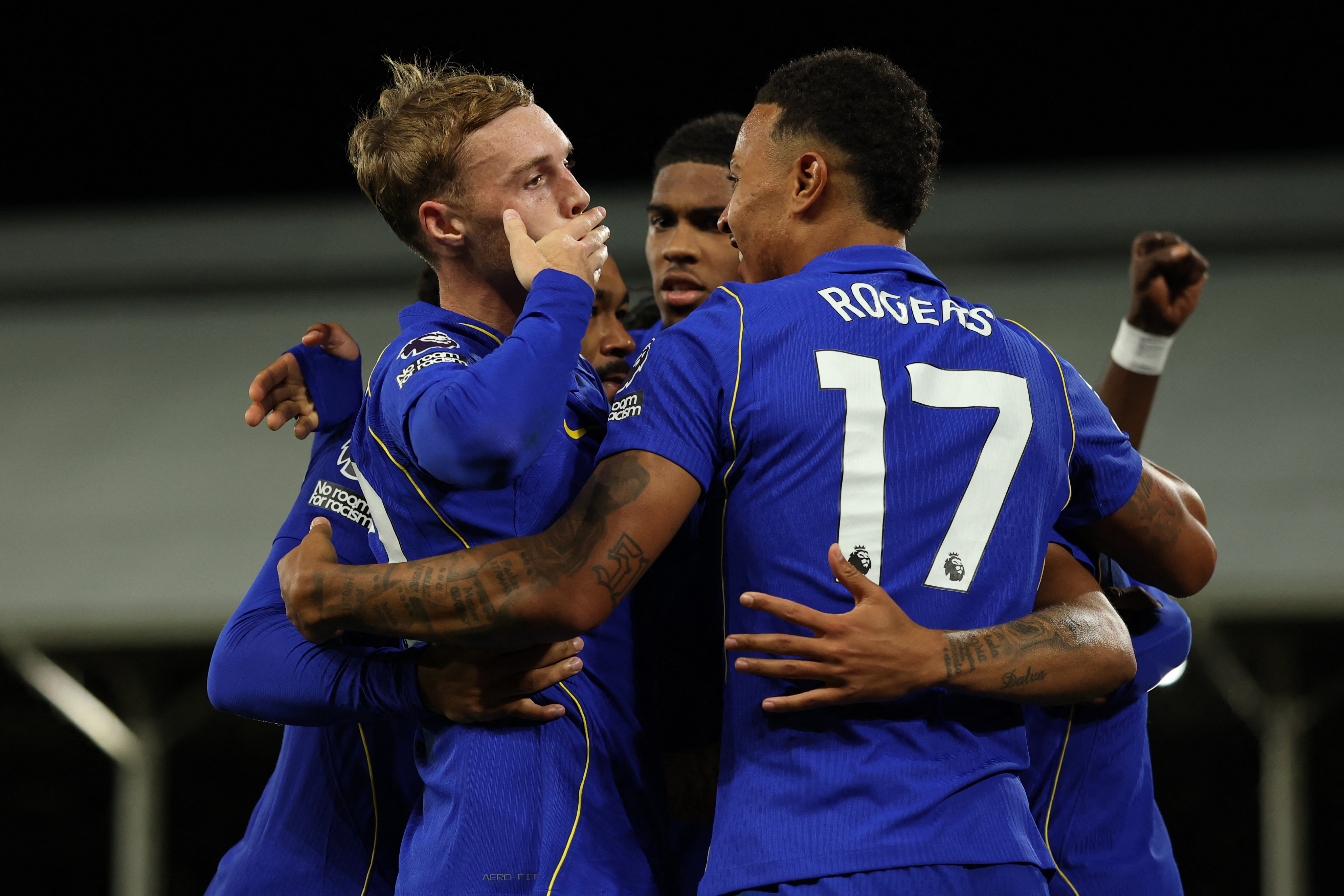 Chelsea's English midfielder #10 Cole Palmer (L) celebrates with teammates after scoring their third goal during the English Premier League football match between Fulham and Chelsea at Craven Cottage in London on August 24, 2026. (Photo by Adrian DENNIS / AFP) / RESTRICTED TO EDITORIAL USE. No use with unauthorized audio, video, data, fixture lists, club/league logos or 'live' services. Online in-match use limited to 120 images. An additional 40 images may be used in extra time. No video emulation. Social media in-match use limited to 120 images. An additional 40 images may be used in extra time. No use in betting publications, games or single club/league/player publications. /