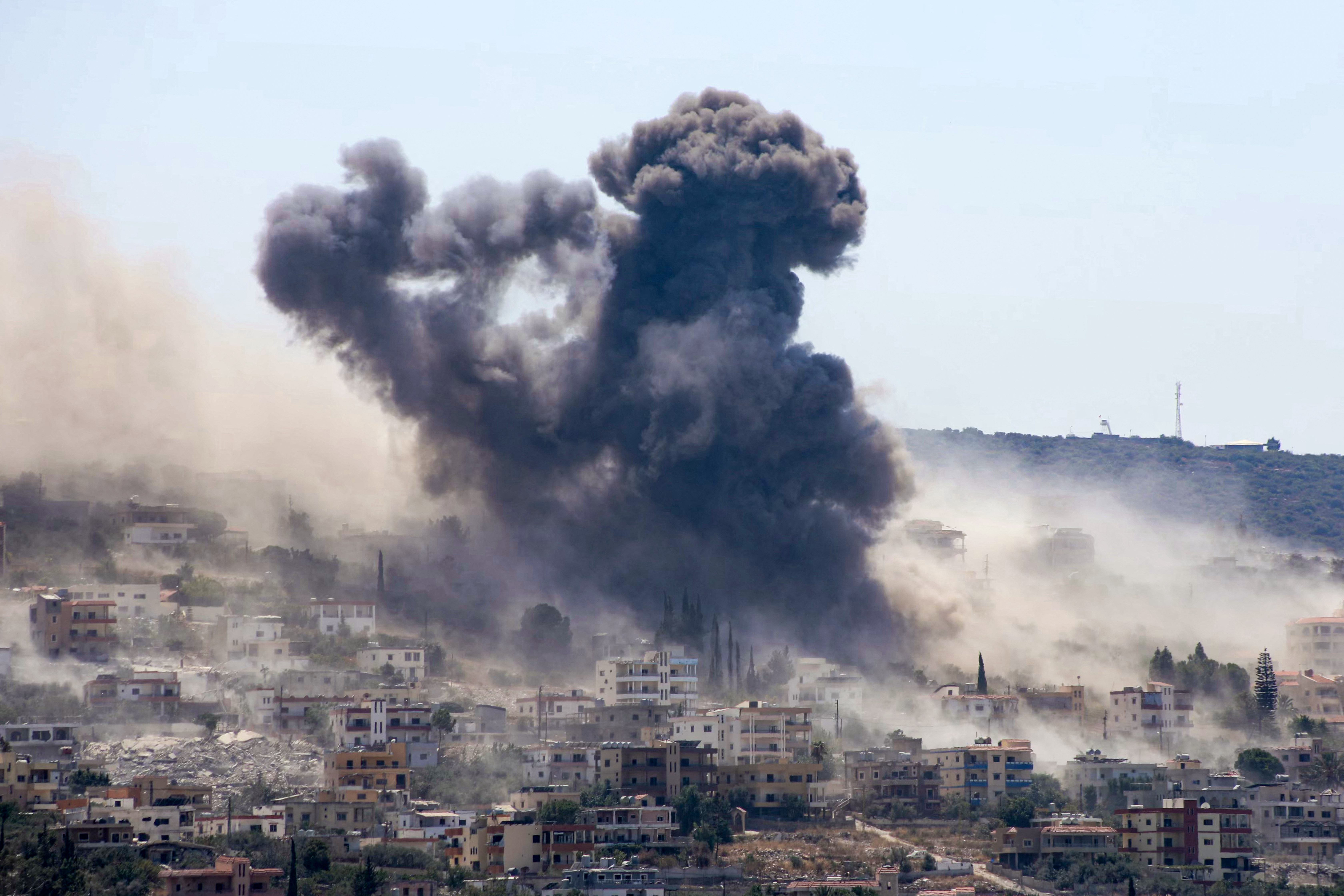 A photograph taken from the southern Lebanese city of Tyre shows smoke rising from the site of a string of Israeli airstrikes that targeted the area of al-Mansouri on August 25, 2026. [Kawnat Haju/AFP]