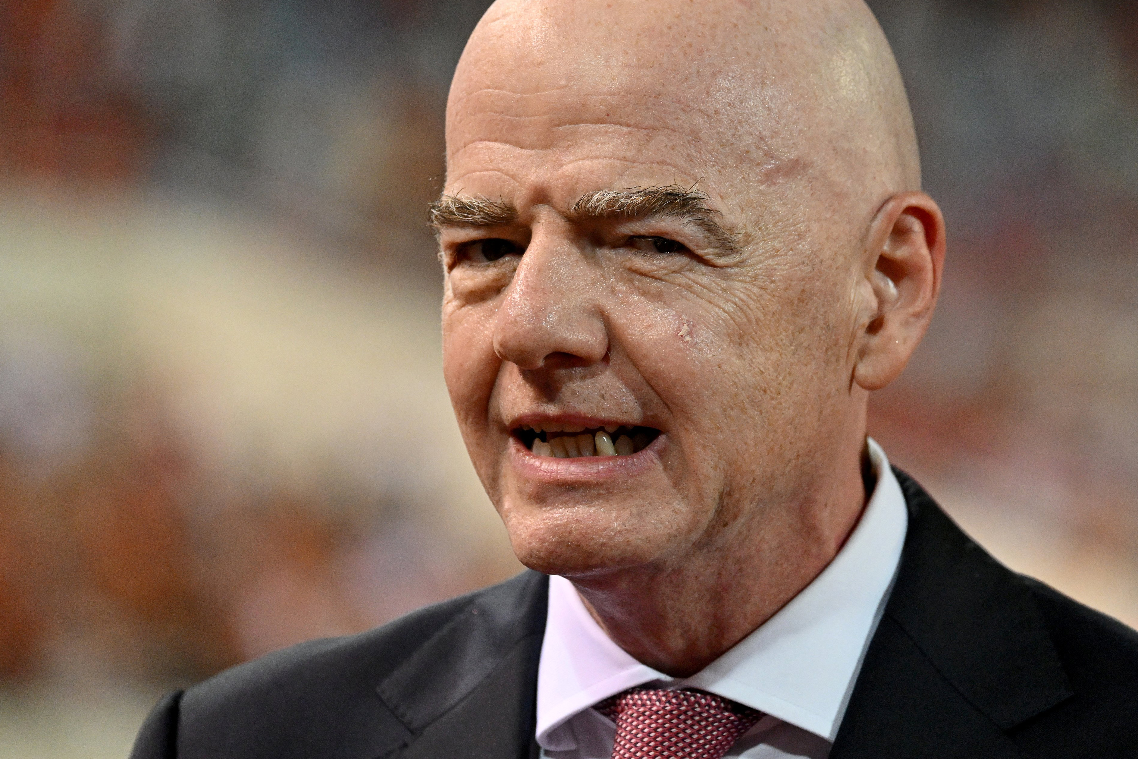 FIFA President Gianni Infantino looks on during the award ceremony at the end of the ASEAN Championship Cup 2026 final football match between Vietnam and Thailand in My Dinh National Stadium in Hanoi on August 26, 2026. (Photo by Nhac NGUYEN / AFP)