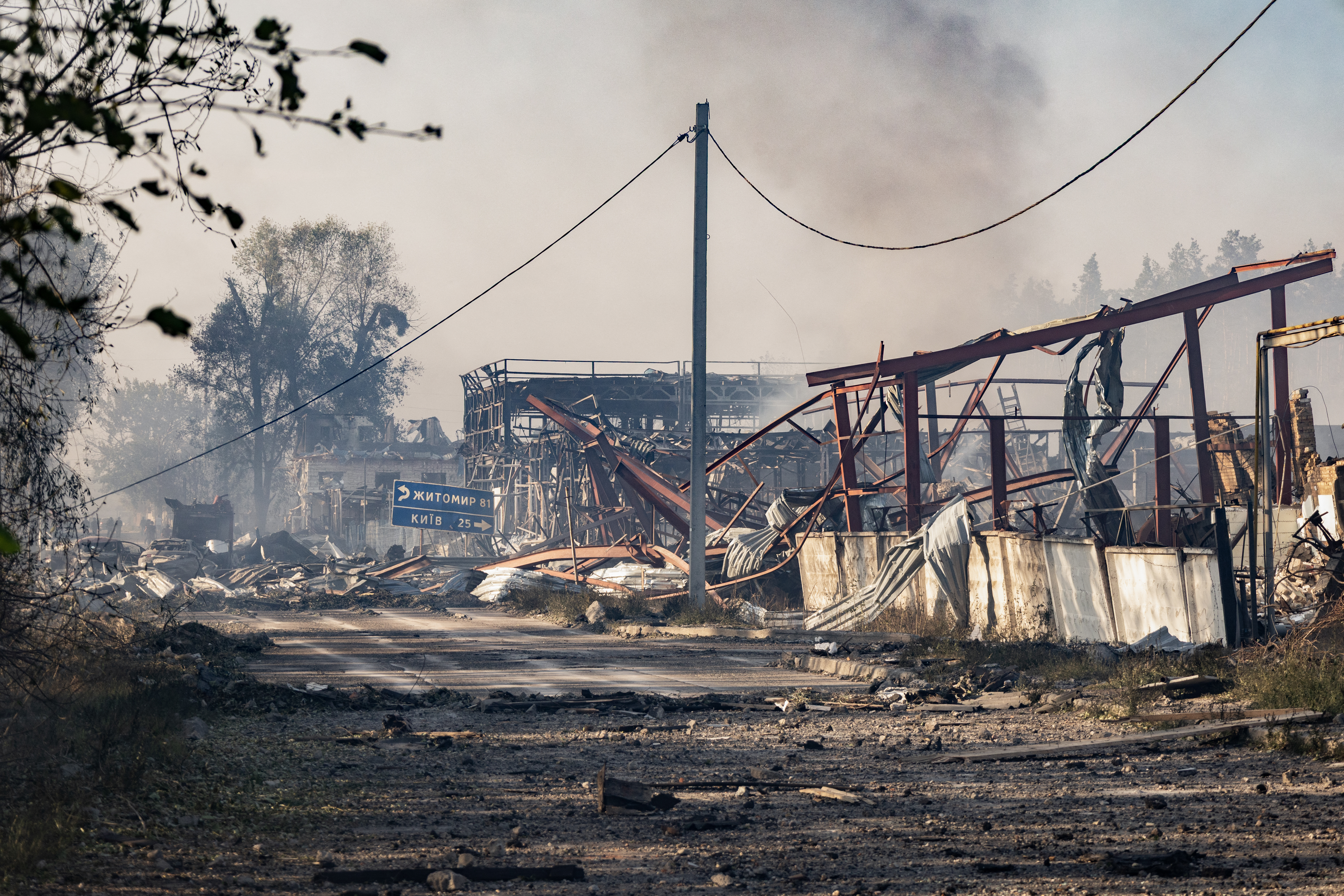 Smoke rises from damaged buildings at the site of a Russian air attack on the Kyiv region