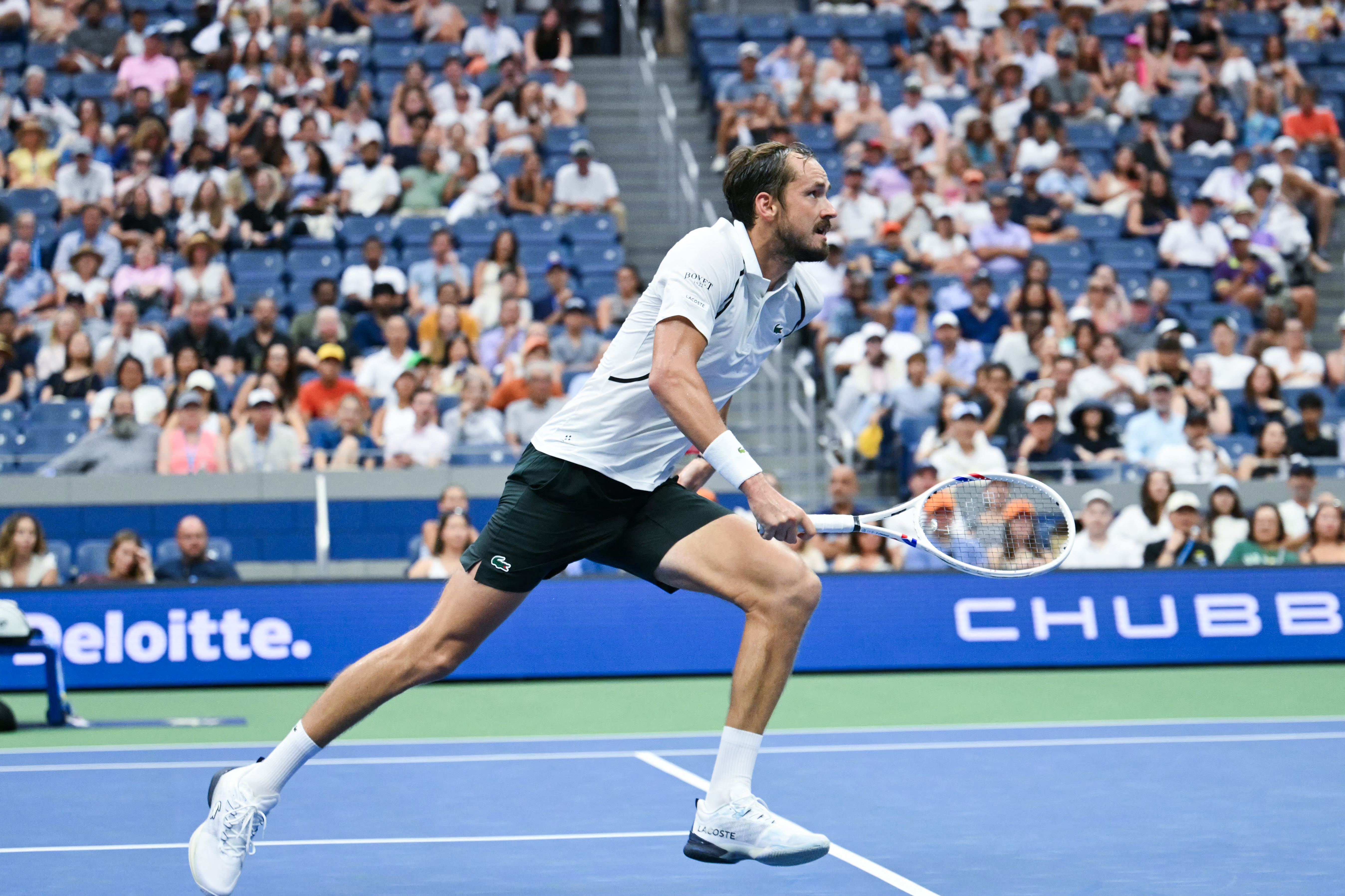 Russia's Daniil Medvedev chases a shot from France's Hugo Gaston during their men's singles first round tennis match on day one of the US Open tennis tournament at the USTA Billie Jean King National Tennis Center in New York on August 30, 2026. (Photo by ANGELA WEISS / AFP)