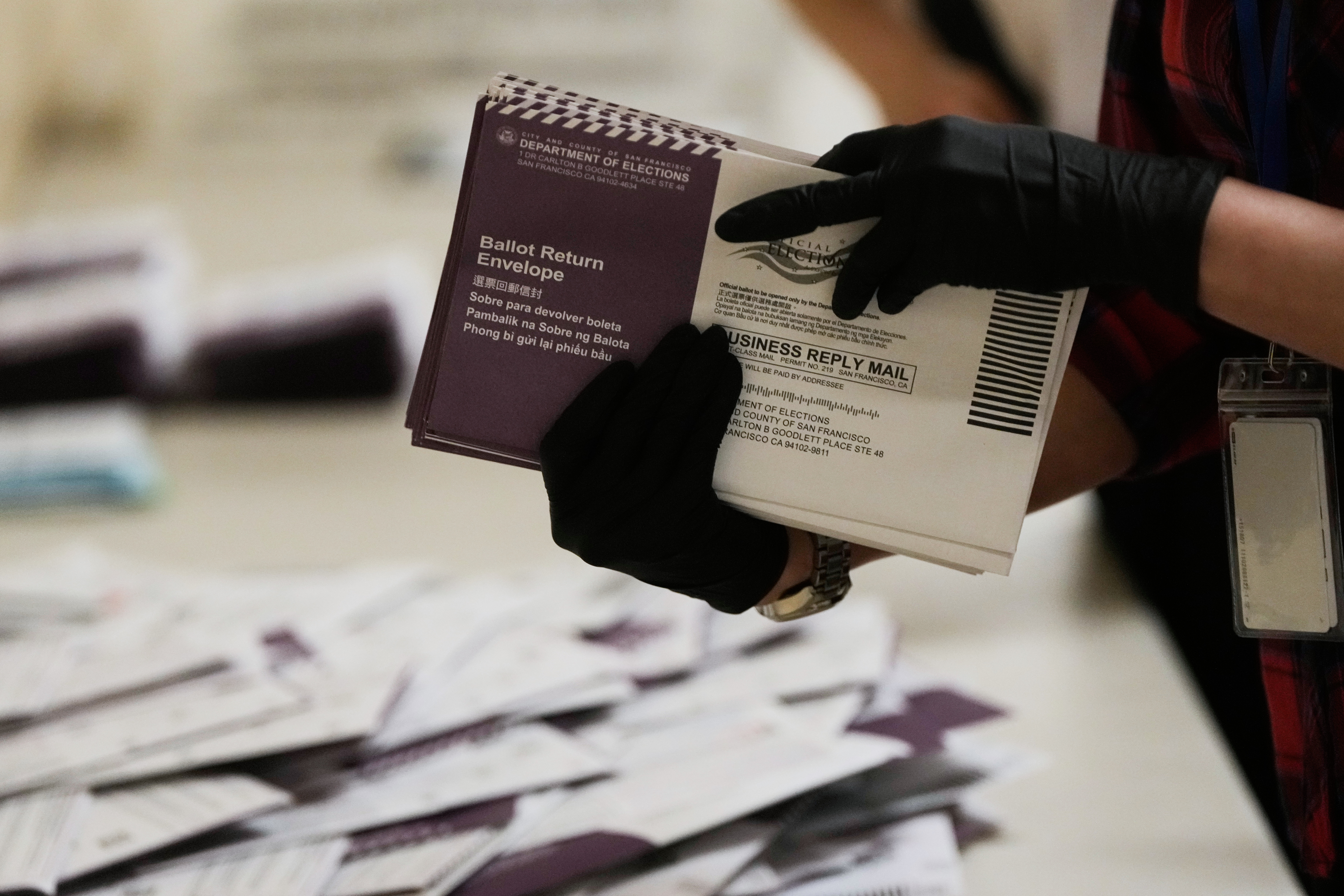 Department of Elections workers sort mail-in ballots for the California primary election at City Hall on Tuesday, June 2, 2026, in San Francisco. (AP Photo/Jeff Chiu)