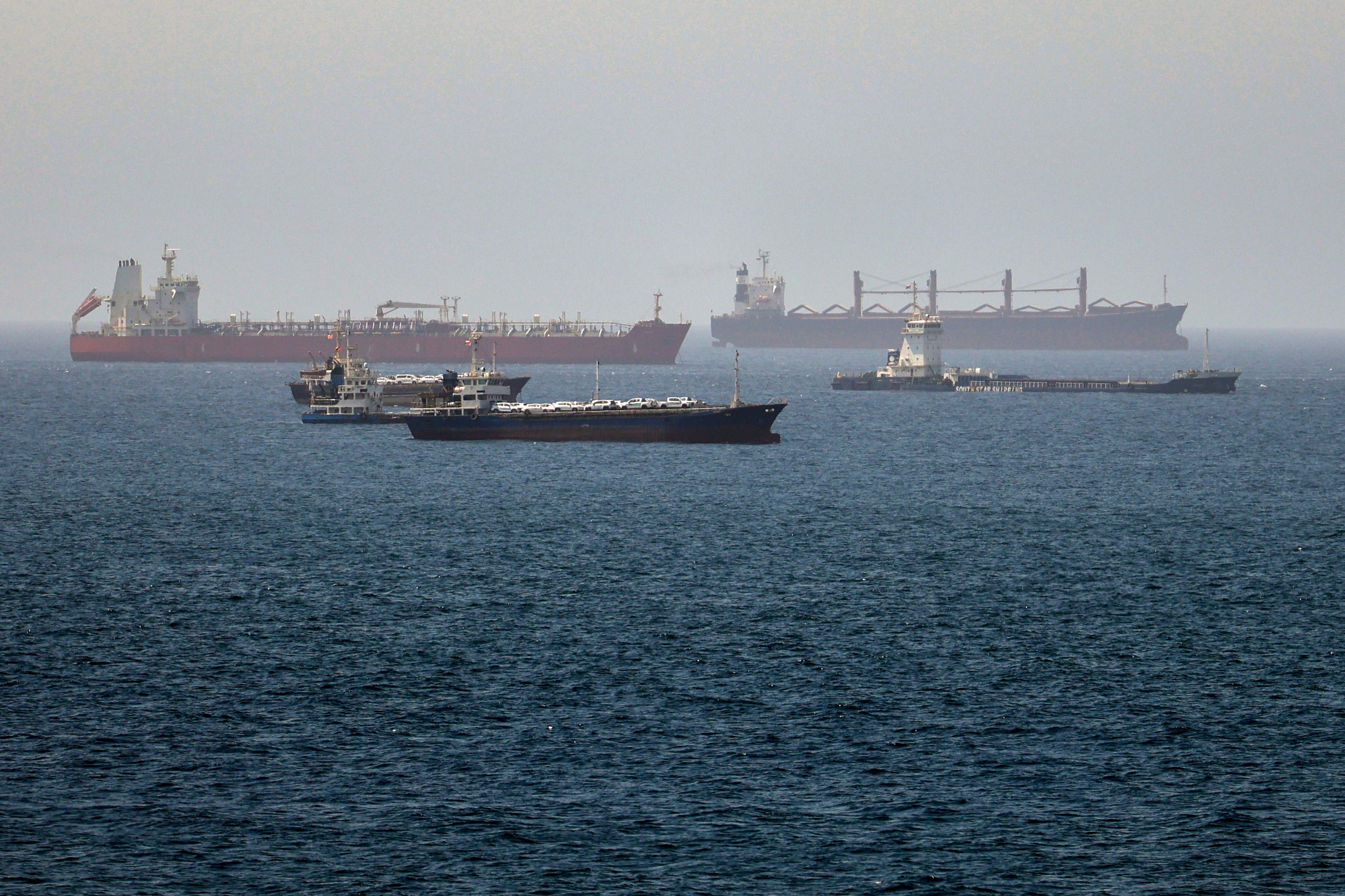 Tankers and cargo vessels are seen in the Gulf of Oman, along shipping routes linking the Strait of Hormuz and the Arabian Sea, Tuesday, June 16, 2026. (AP Photo)