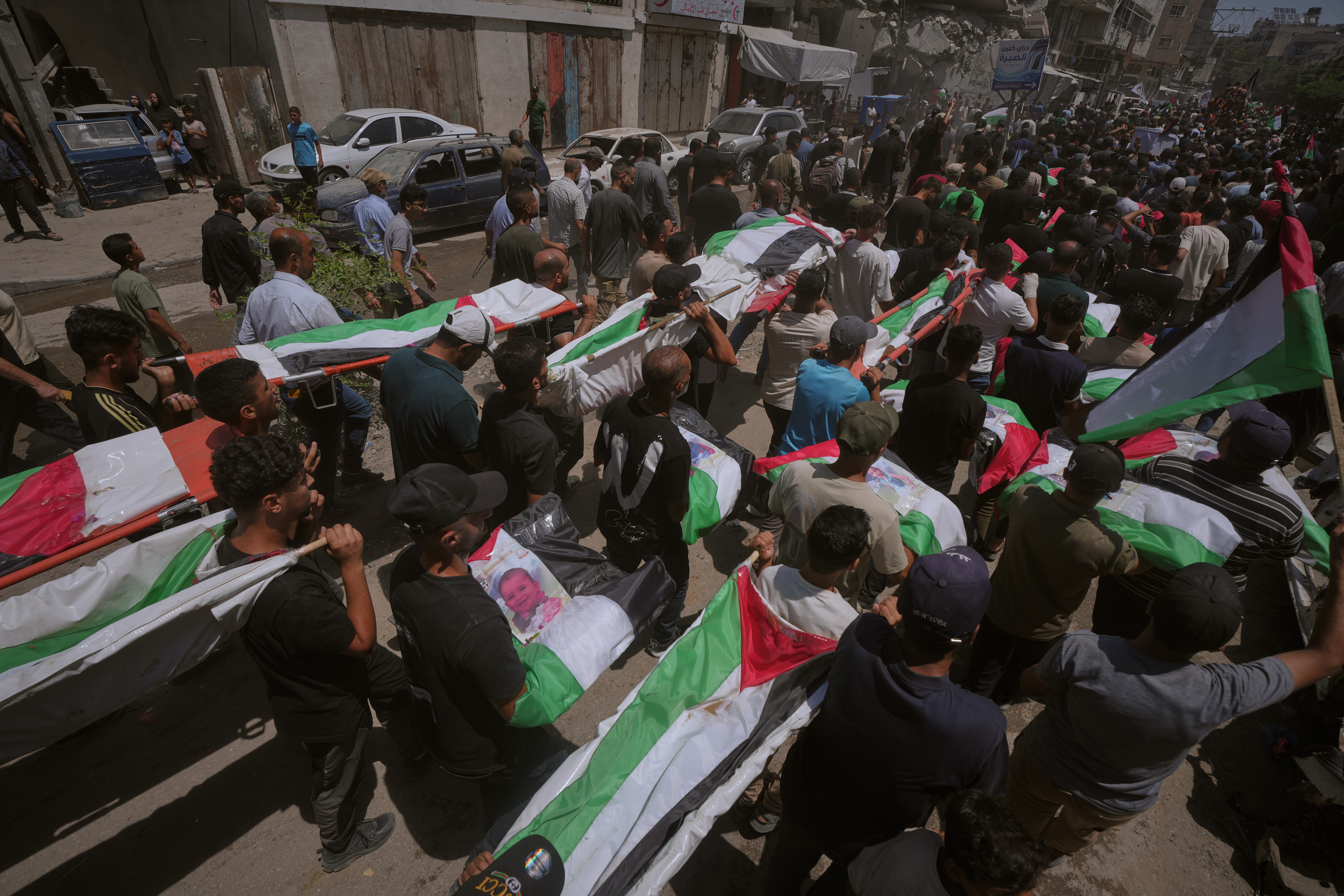 Thousands mourn 112 Palestinians at mass funeral in Gaza City