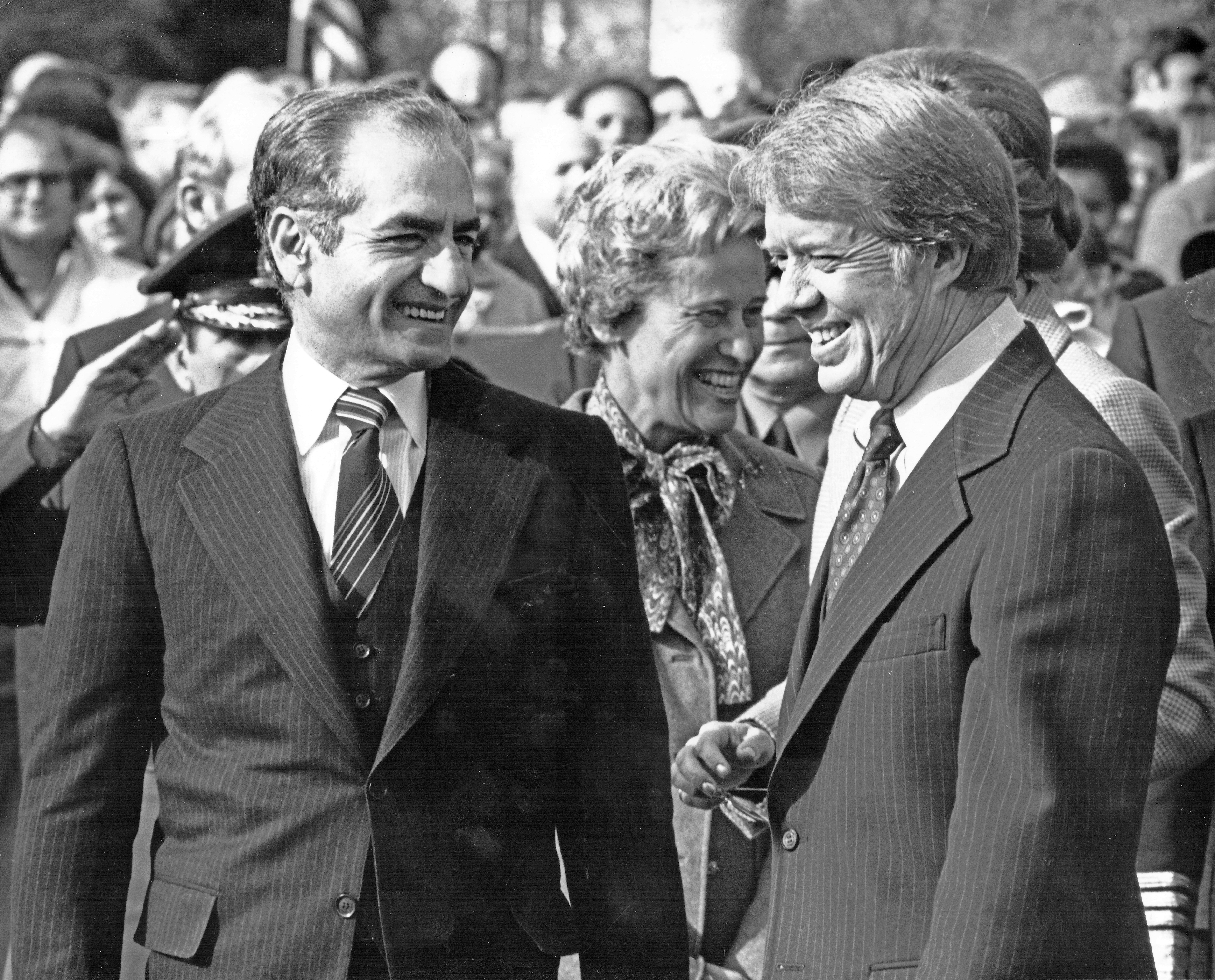 View of the Shah of Iran Mohammed Reza Pahlavi (left) and US President Jimmy Carter as they share a smile during a State Visit on the South Lawn of the White House, Washington DC, November 15, 1977.
