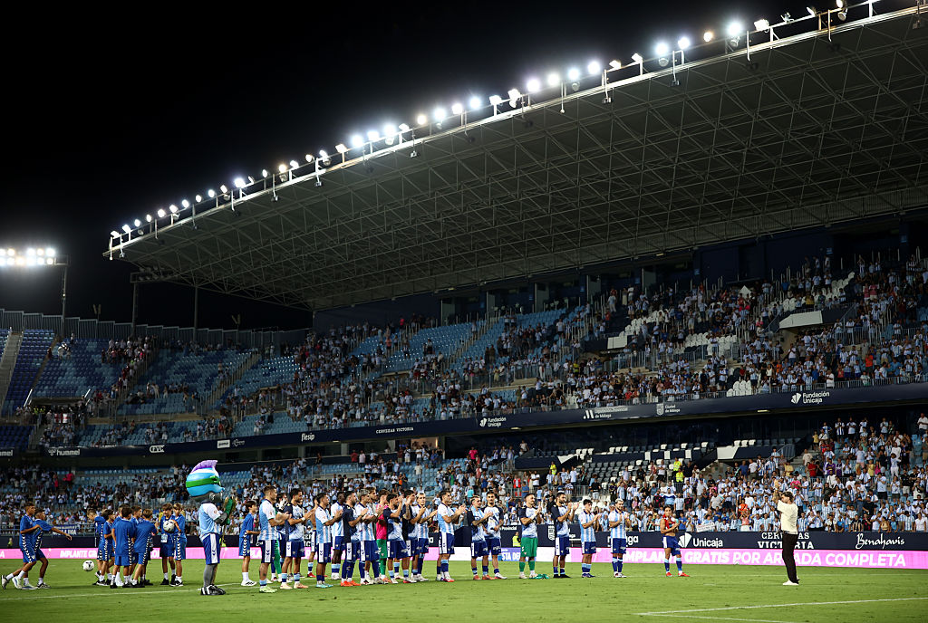 Malaga players stay to celebrate with their fans after Fulham’s walk-off in the Trofeo Costa del Sol preseason friendly